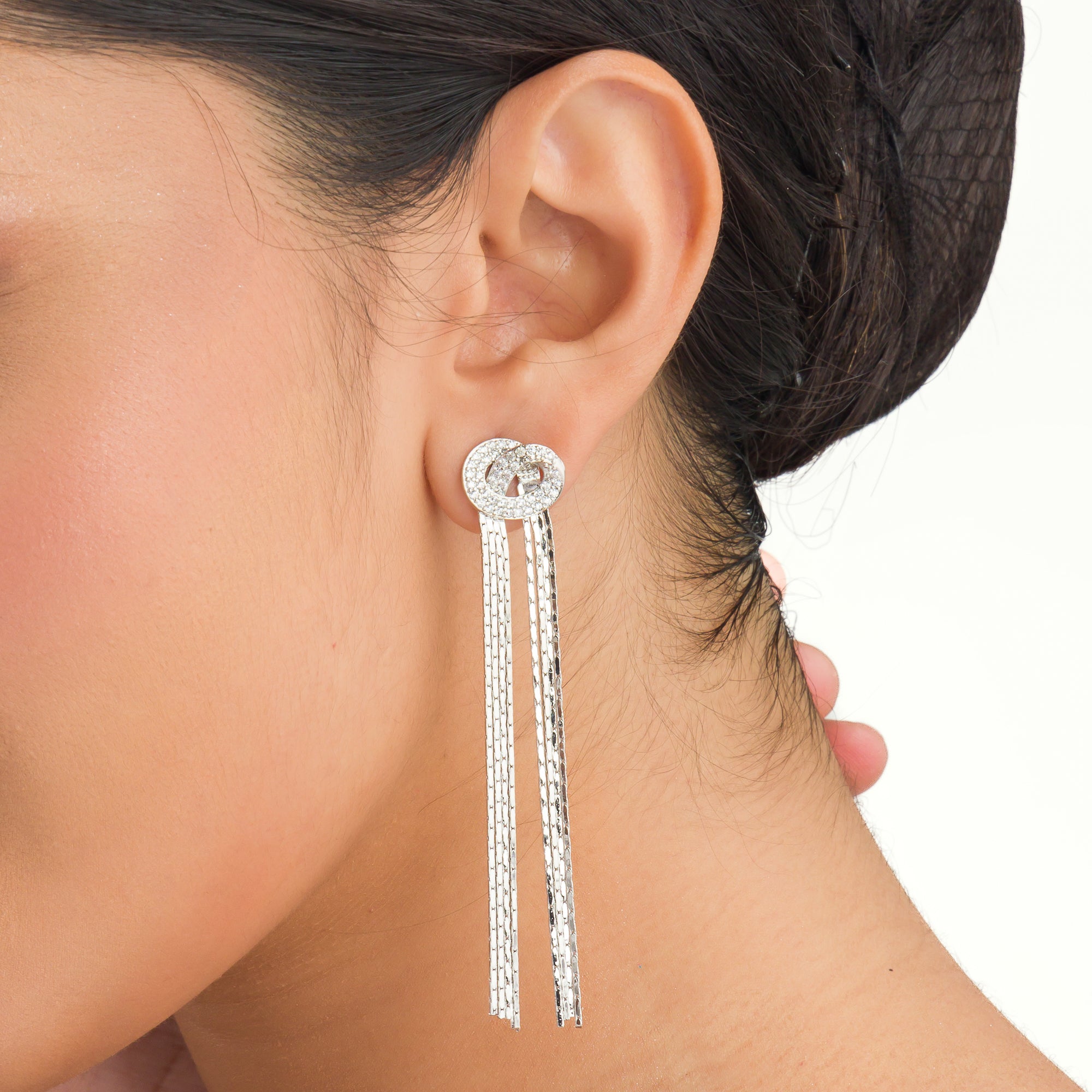 "Trendy zircon and stainless steel long earrings combine modern chic with sparkling elegance."