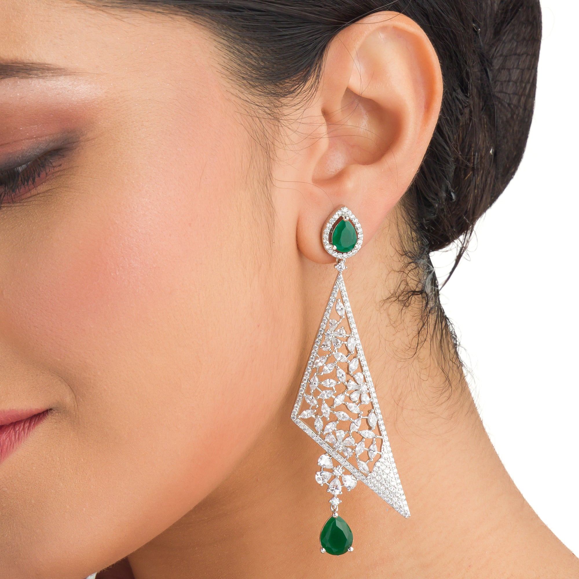 "Vibrant green zircon dangler earrings radiate rich, emerald-like sparkle and elegance."