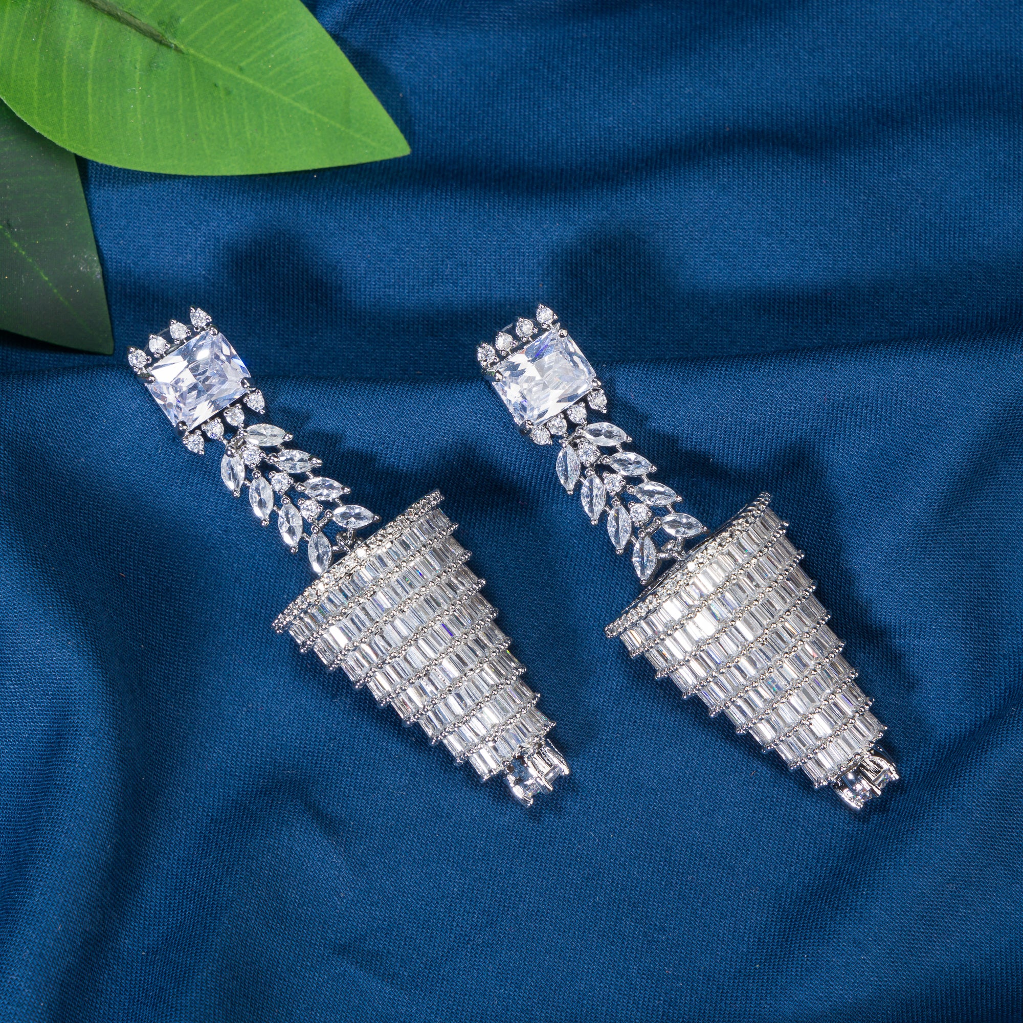 "Graceful long zircon earrings shimmer with timeless sophistication and dazzling elegance."