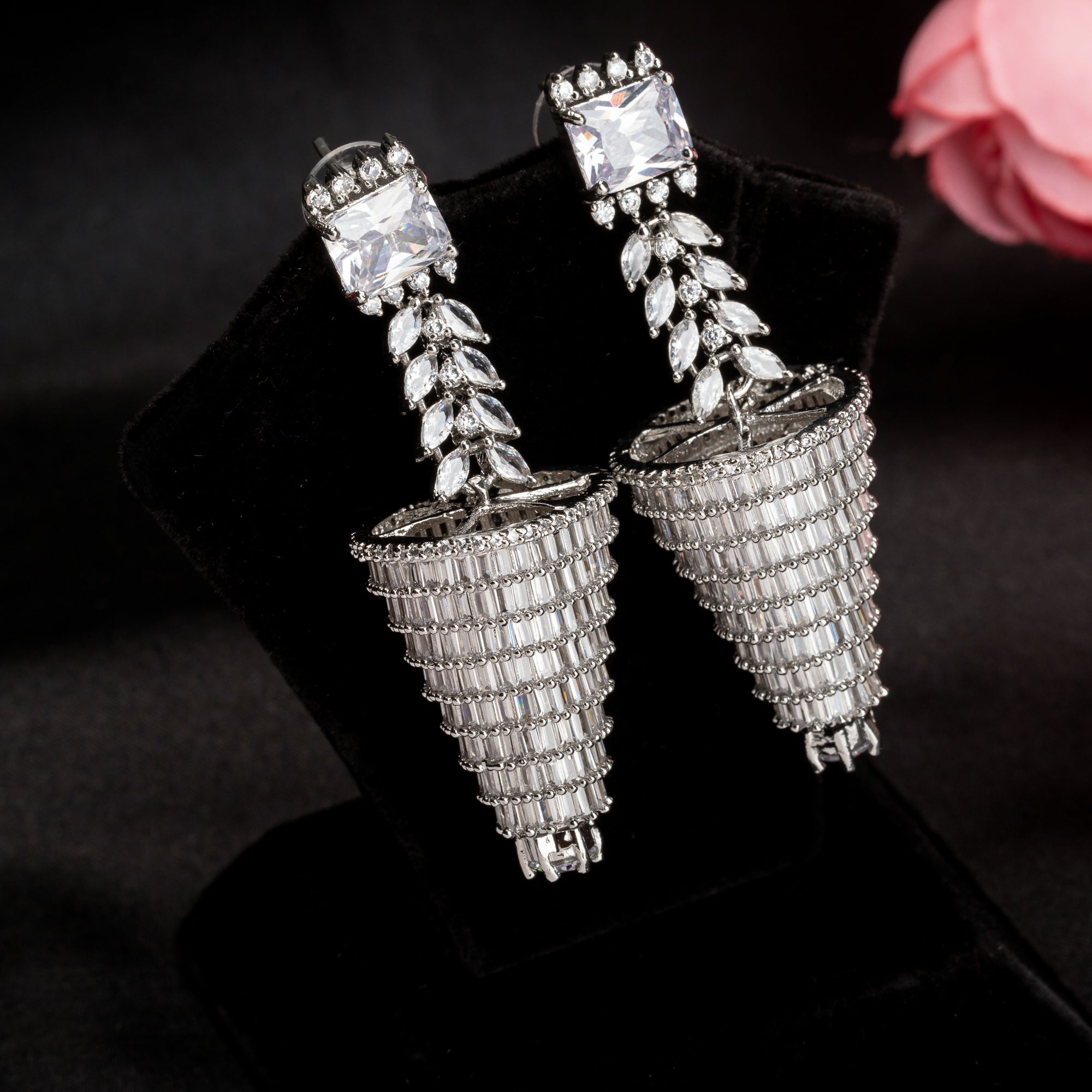 "Graceful long zircon earrings shimmer with timeless sophistication and dazzling elegance."