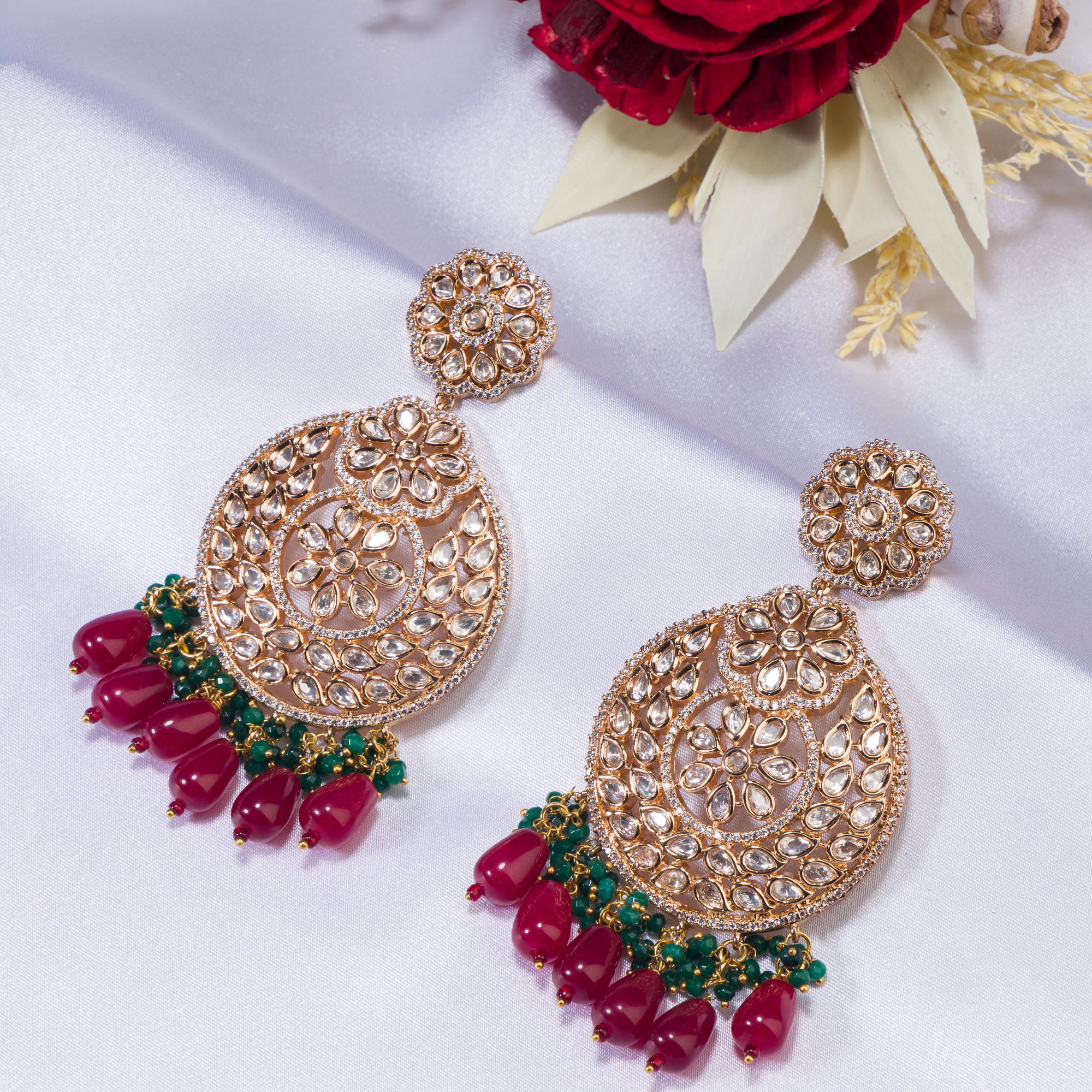 1. "Intricately designed kundan earrings radiate timeless elegance and regal charm."
