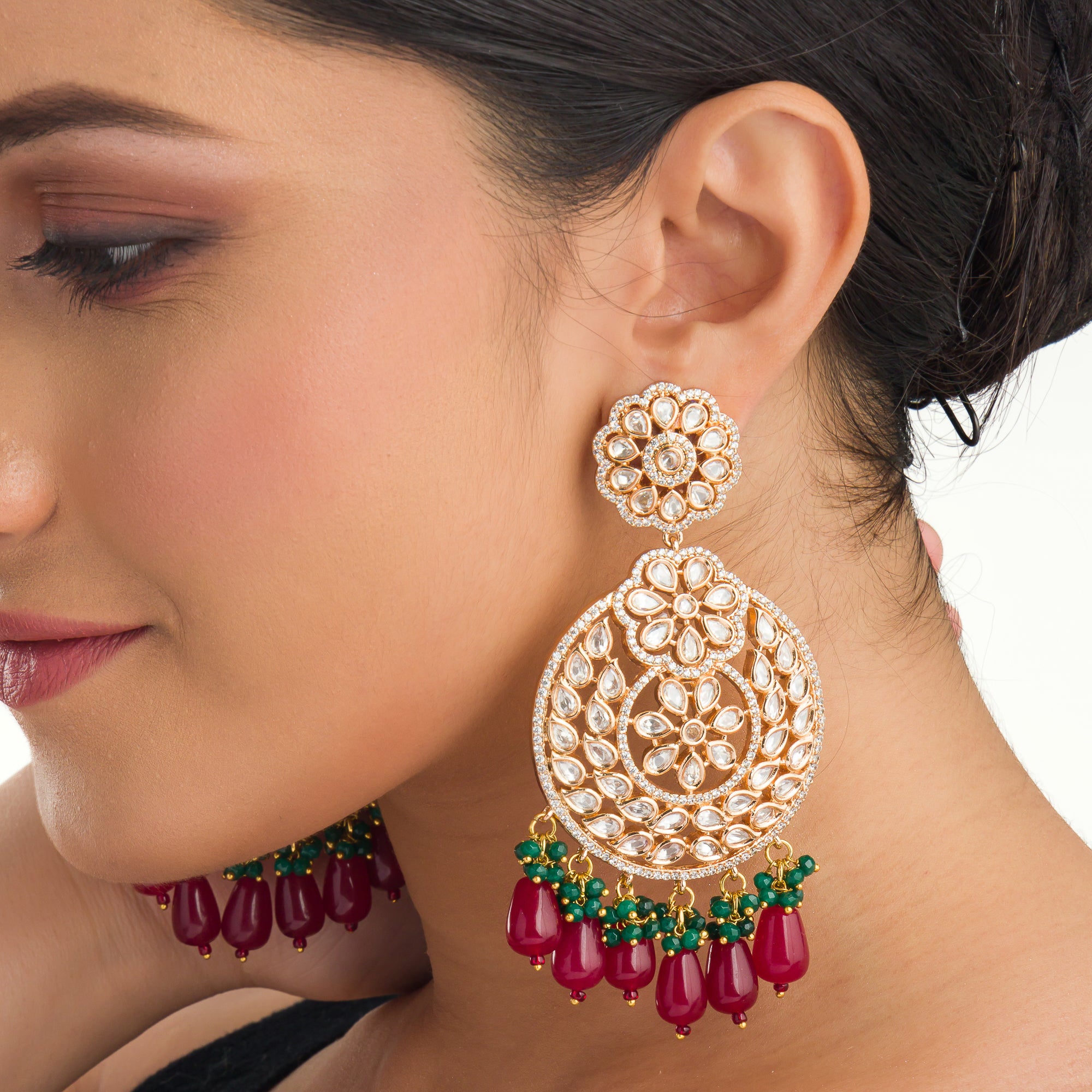 1. "Intricately designed kundan earrings radiate timeless elegance and regal charm."