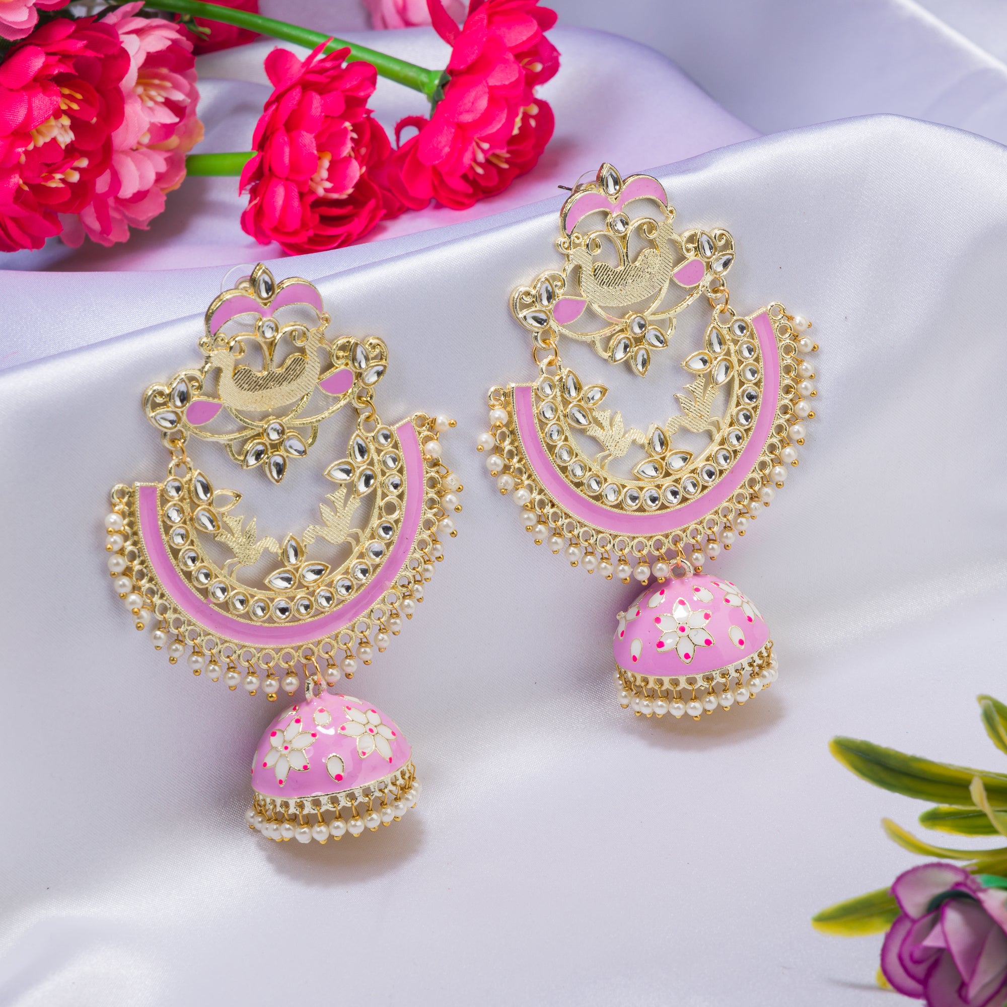 "Oversized pink jhumka with intricate detailing adds a bold, elegant touch to any outfit."