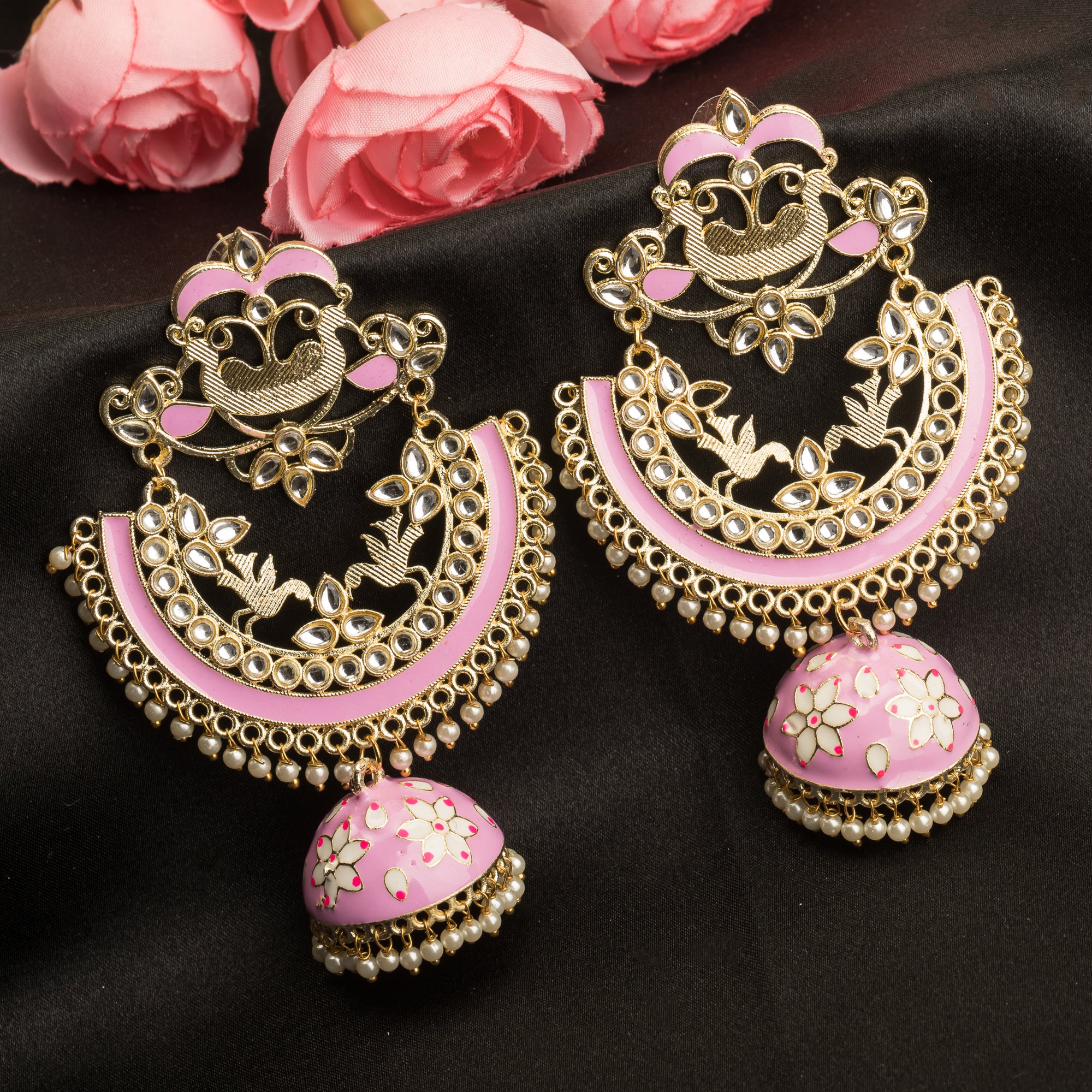 "Oversized pink jhumka with intricate detailing adds a bold, elegant touch to any outfit."