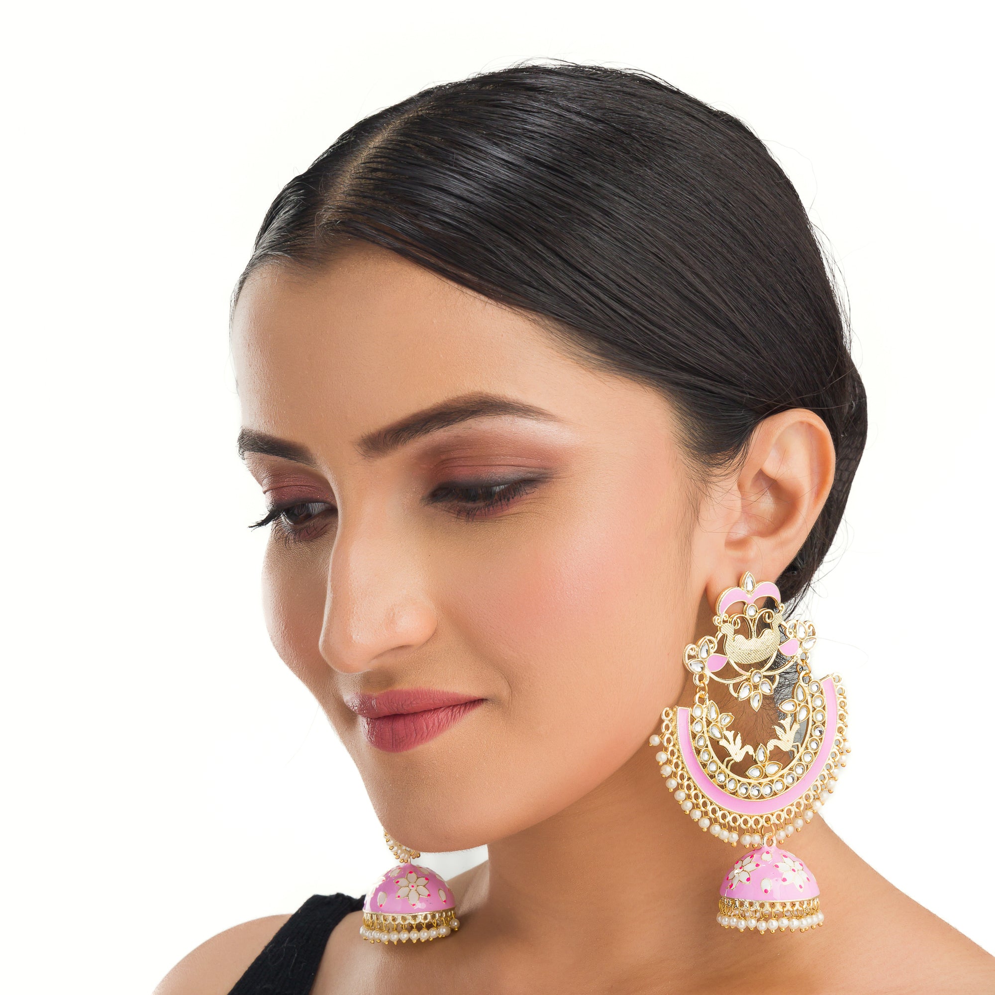 "Oversized pink jhumka with intricate detailing adds a bold, elegant touch to any outfit."
