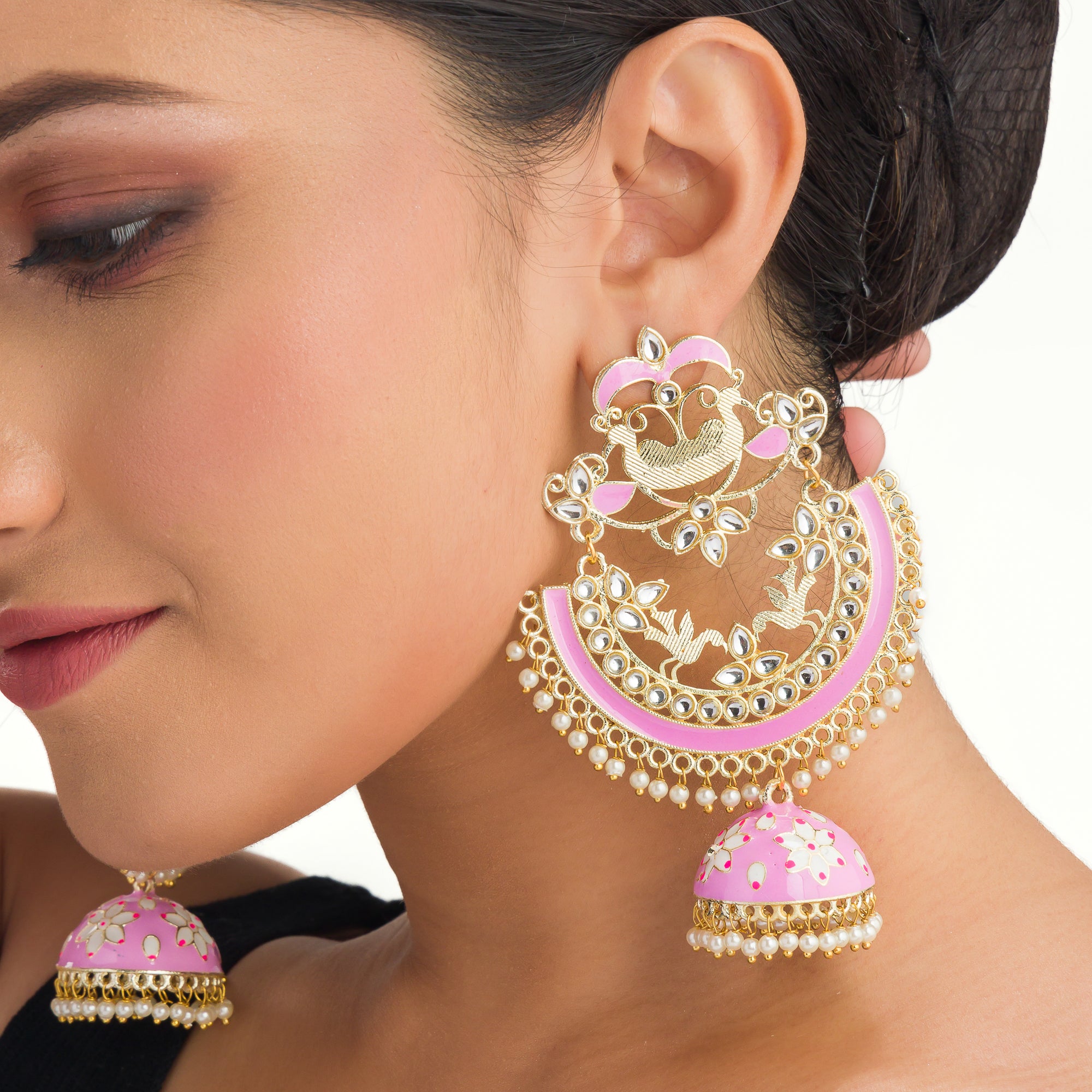 "Oversized pink jhumka with intricate detailing adds a bold, elegant touch to any outfit."