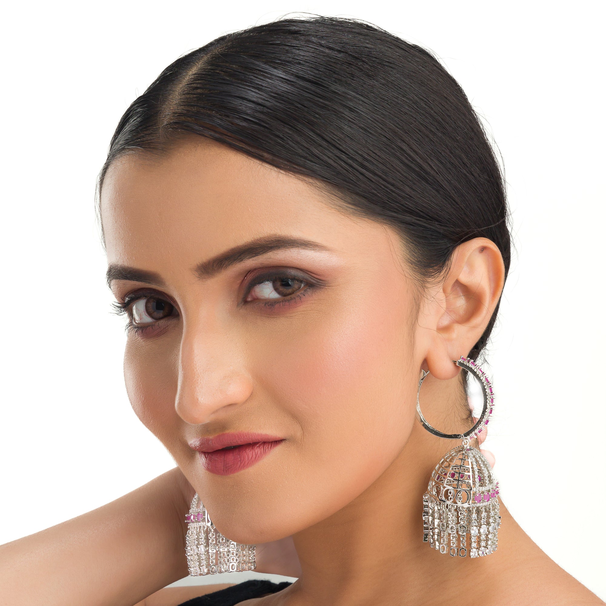 "Pink zircon big jhumka features vibrant design with intricate detailing for a bold look."