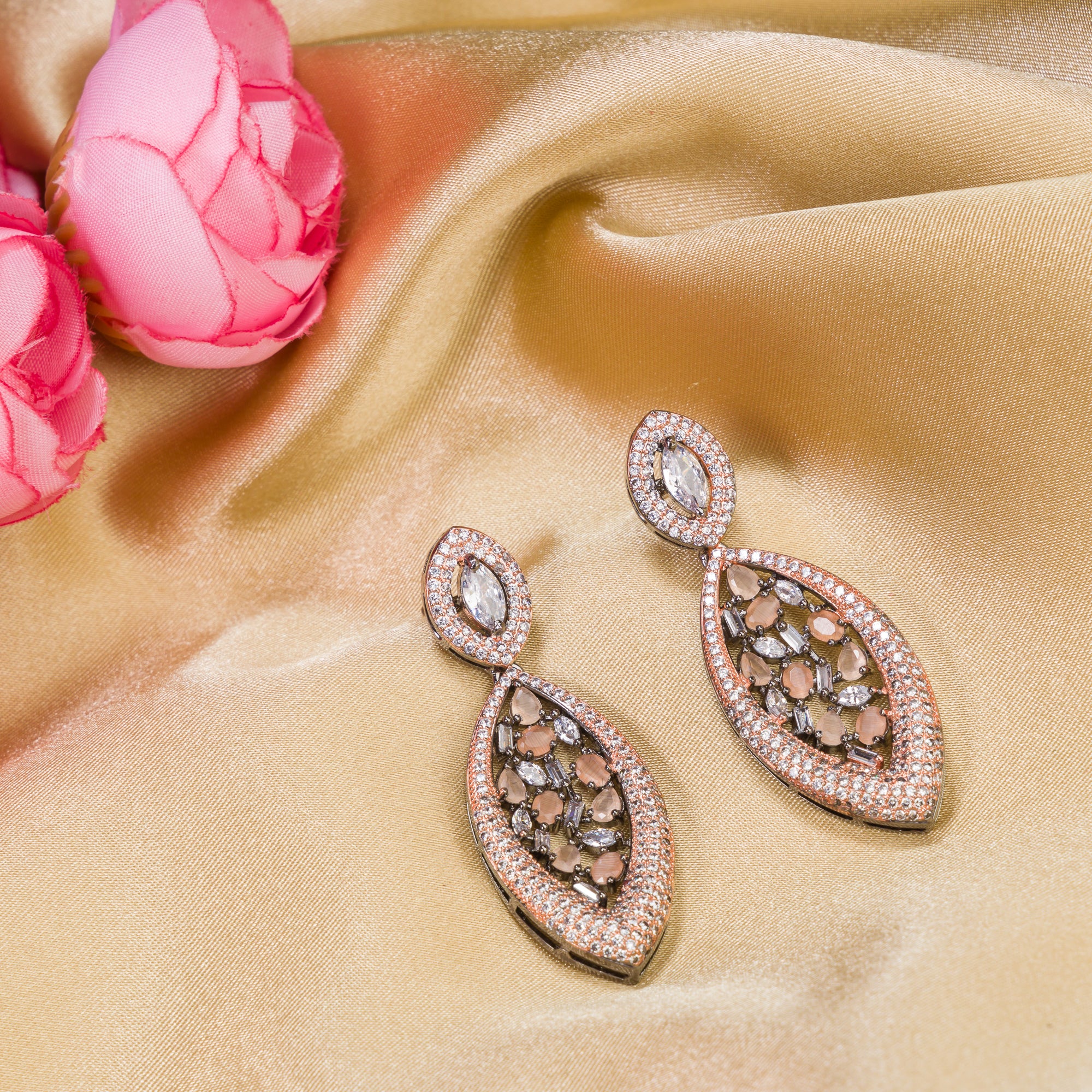 1. "Rose gold earrings with salmon zircon exude warm, radiant charm with sophisticated elegance."