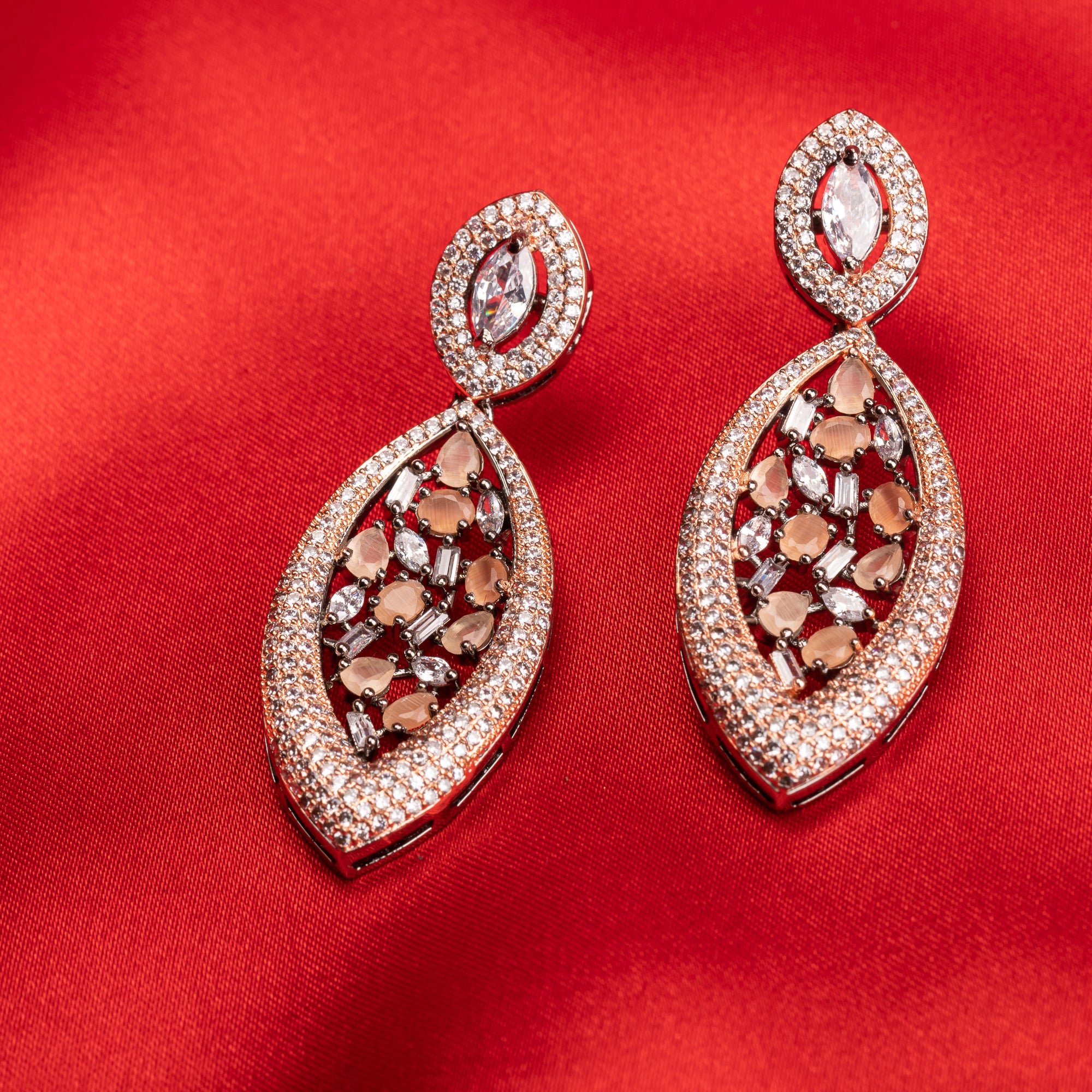1. "Rose gold earrings with salmon zircon exude warm, radiant charm with sophisticated elegance."