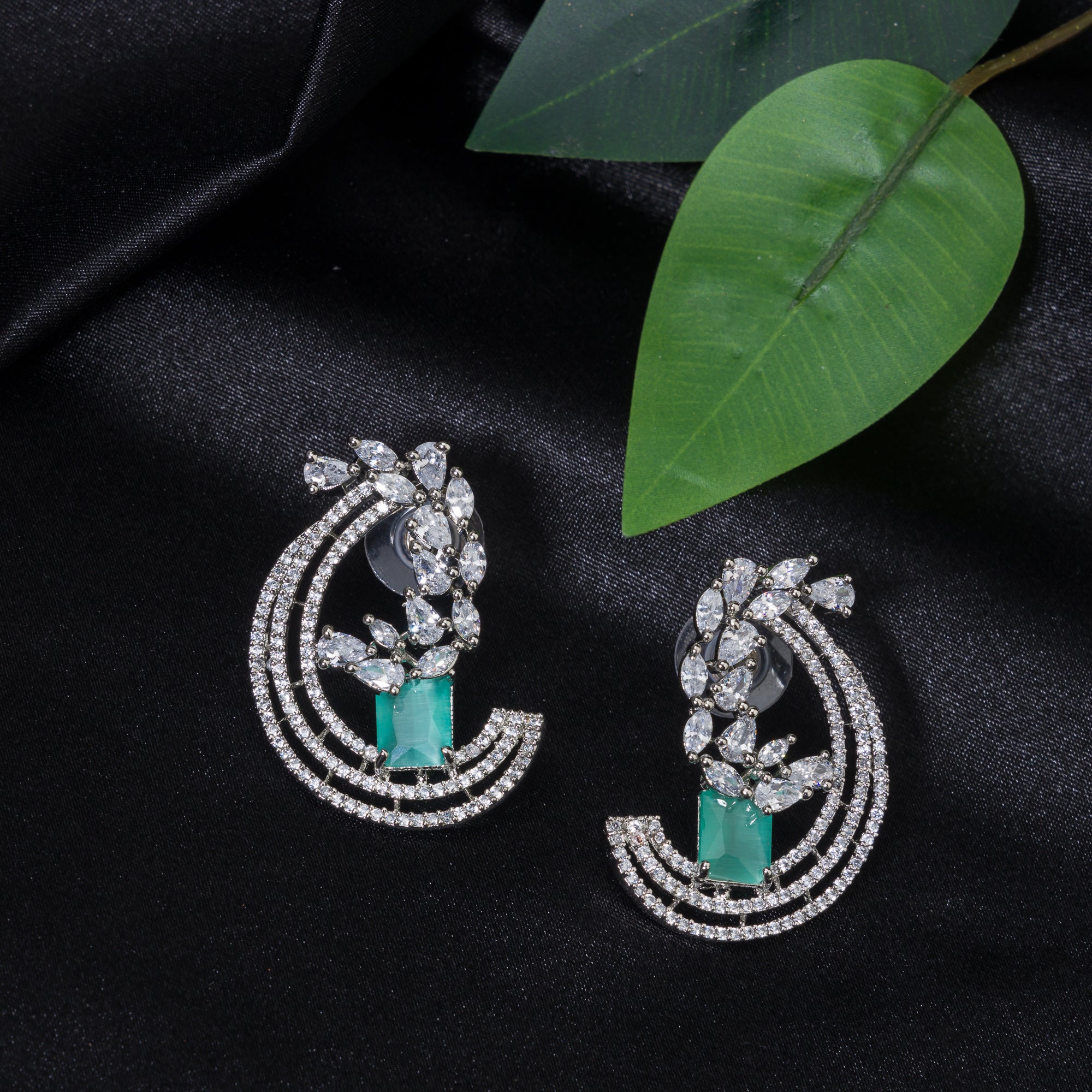 "Stunning turquoise zircon earrings add a touch of elegance and sparkle to any outfit."