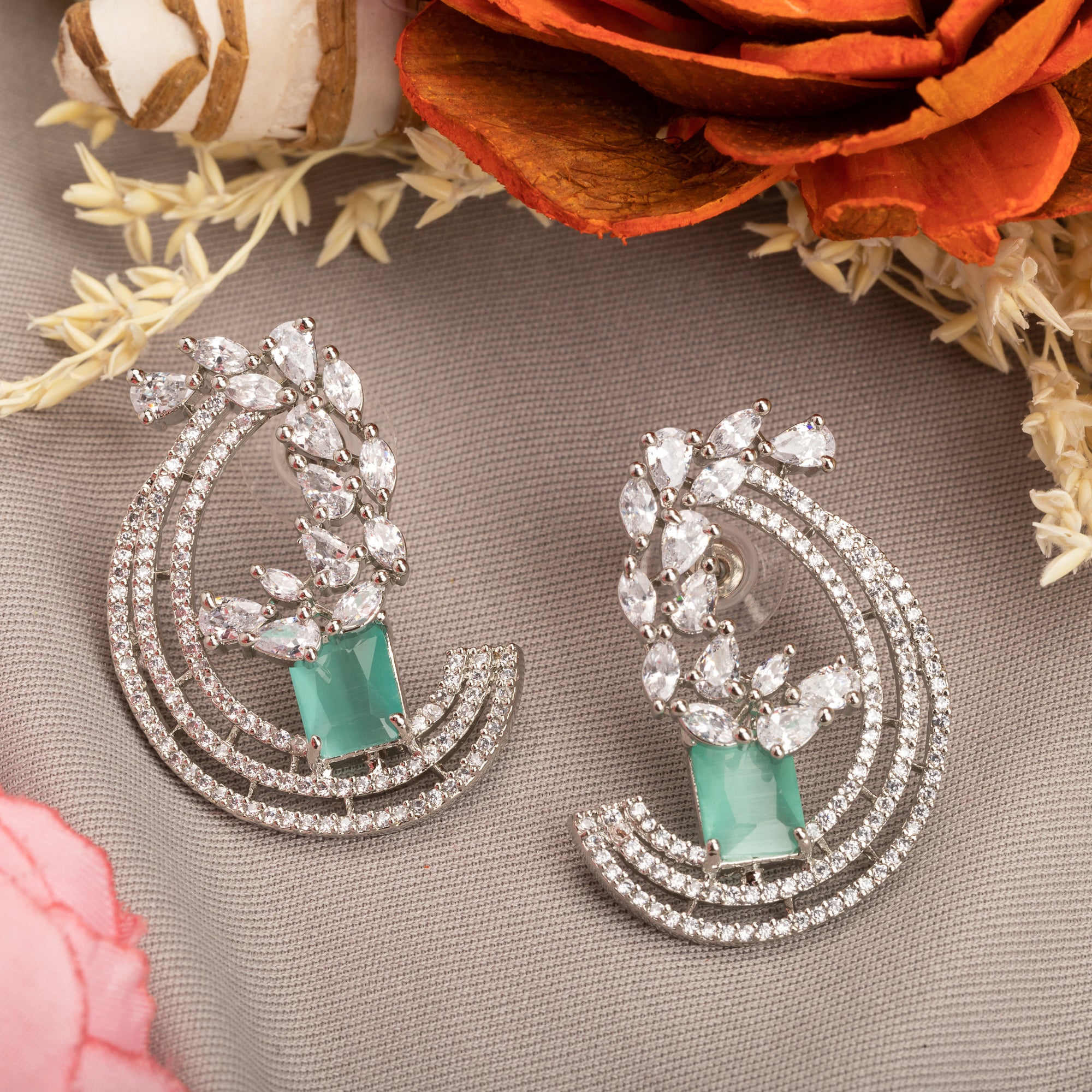 "Stunning turquoise zircon earrings add a touch of elegance and sparkle to any outfit."