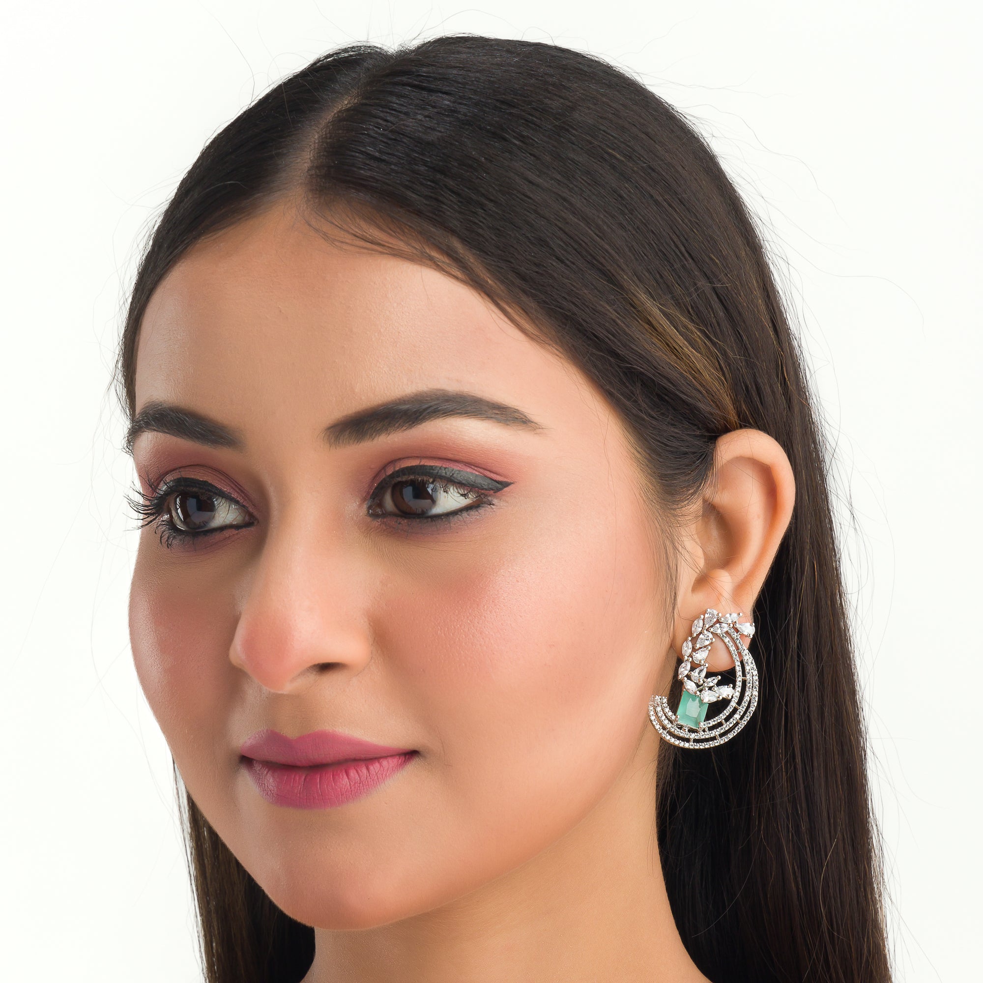 "Stunning turquoise zircon earrings add a touch of elegance and sparkle to any outfit."