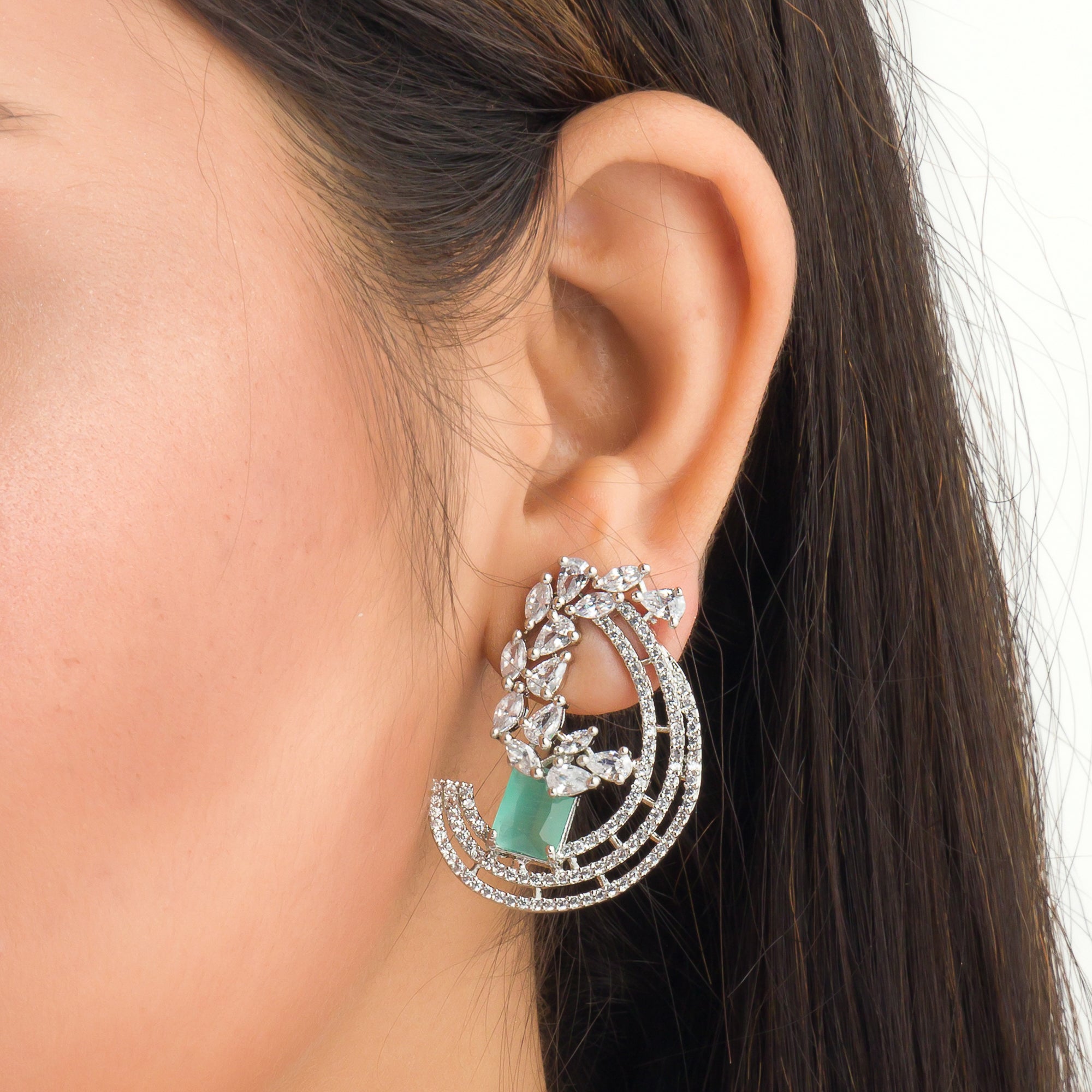 "Stunning turquoise zircon earrings add a touch of elegance and sparkle to any outfit."