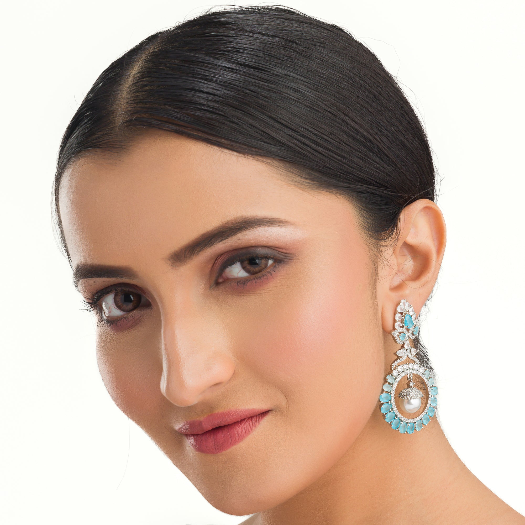 "Aqua zircon earrings with a captivating hue bring elegance and sparkle to your look."