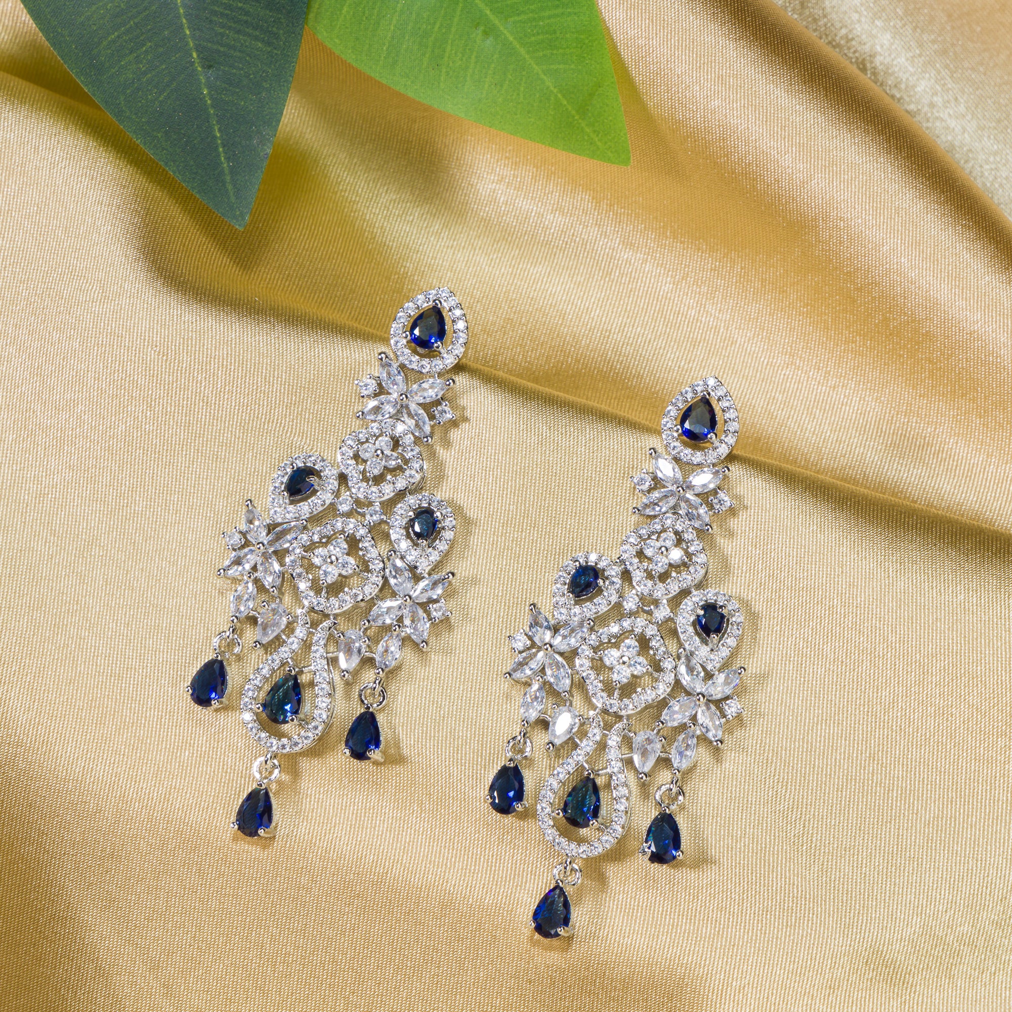 "Light blue zircon earrings offer delicate sparkle with a hint of serene elegance."