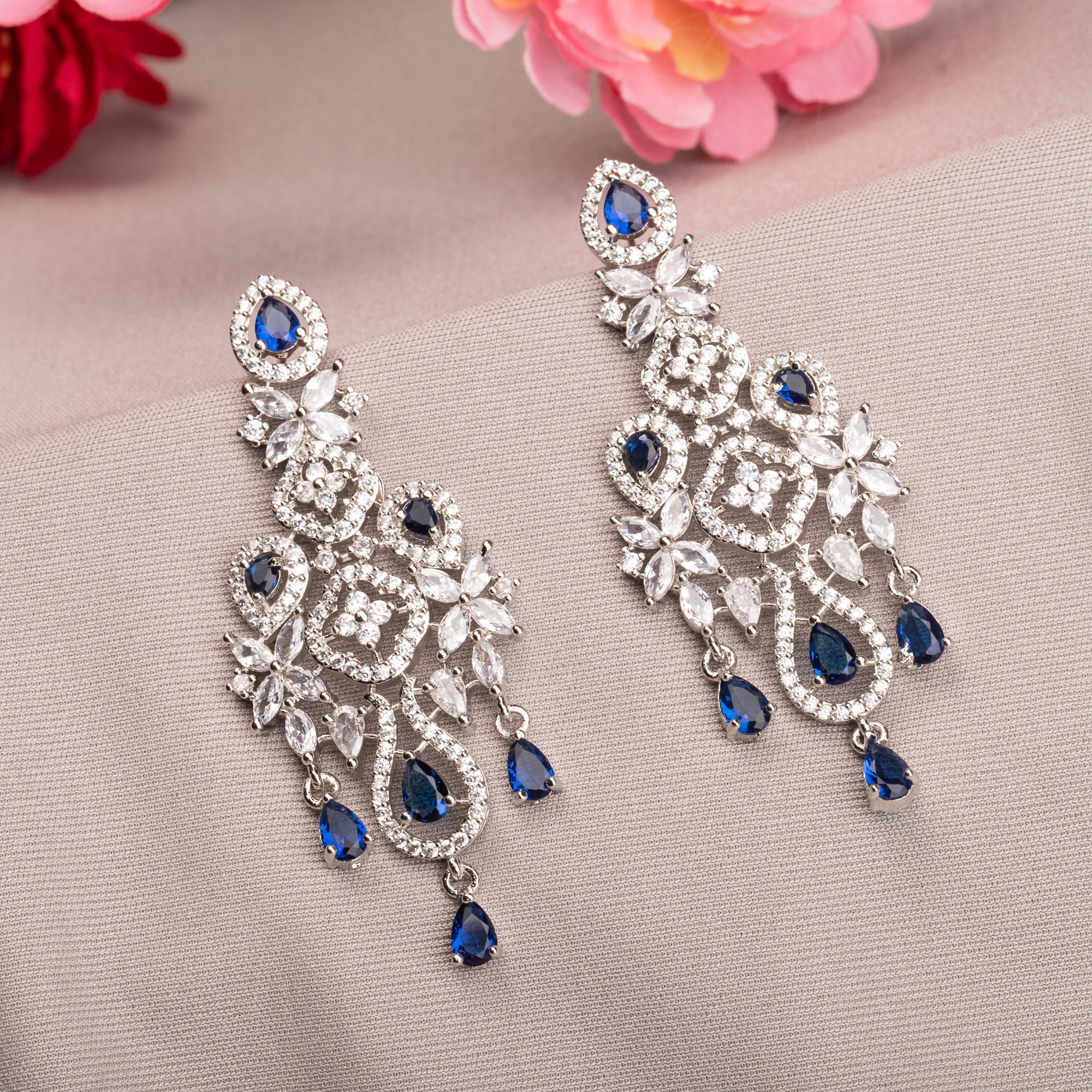 "Light blue zircon earrings offer delicate sparkle with a hint of serene elegance."