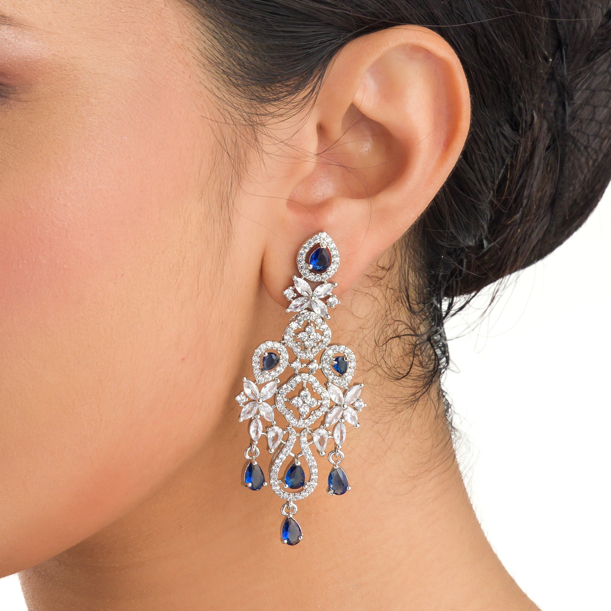 "Light blue zircon earrings offer delicate sparkle with a hint of serene elegance."