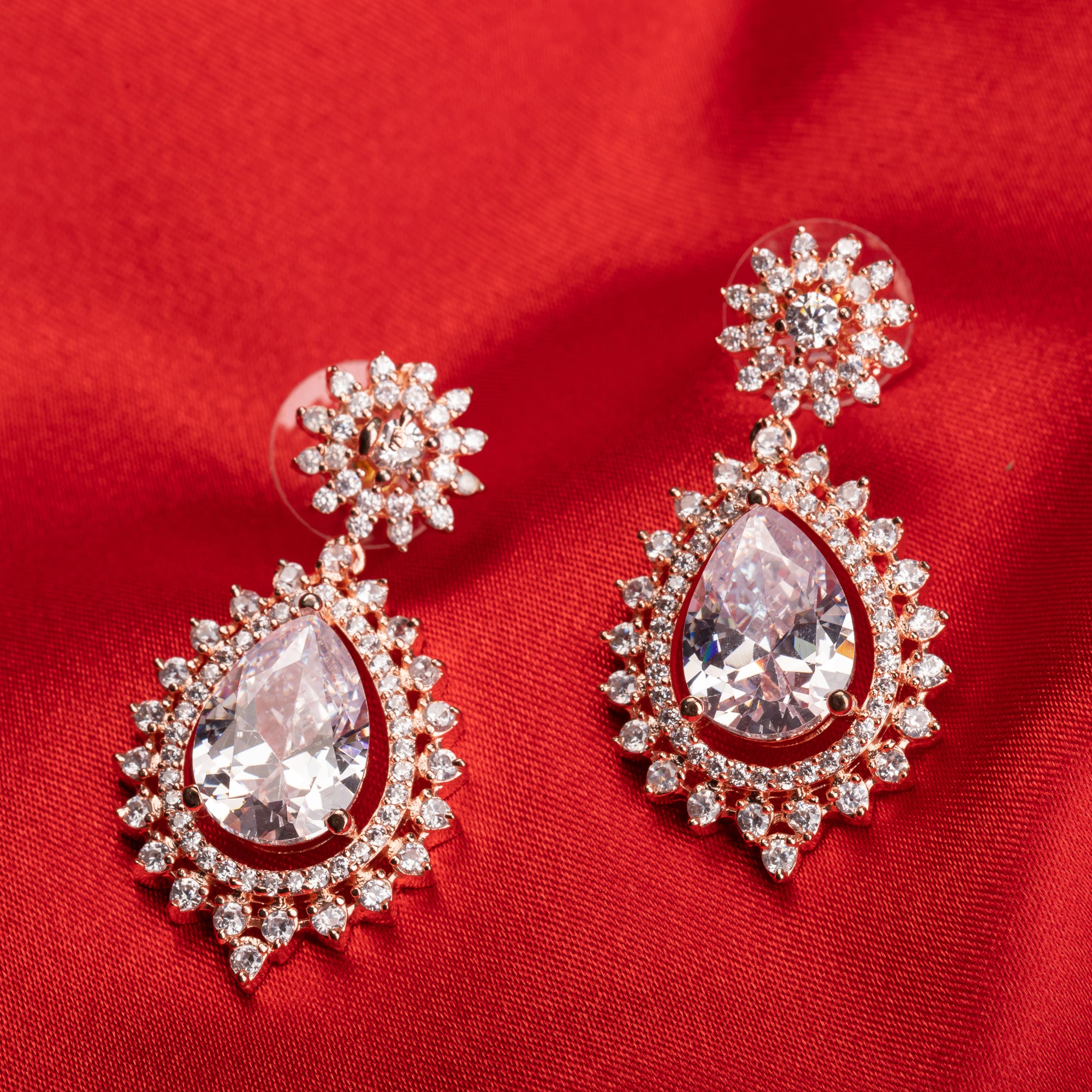 "Rose gold zircon earrings add elegance and sparkle to any look with timeless shine."