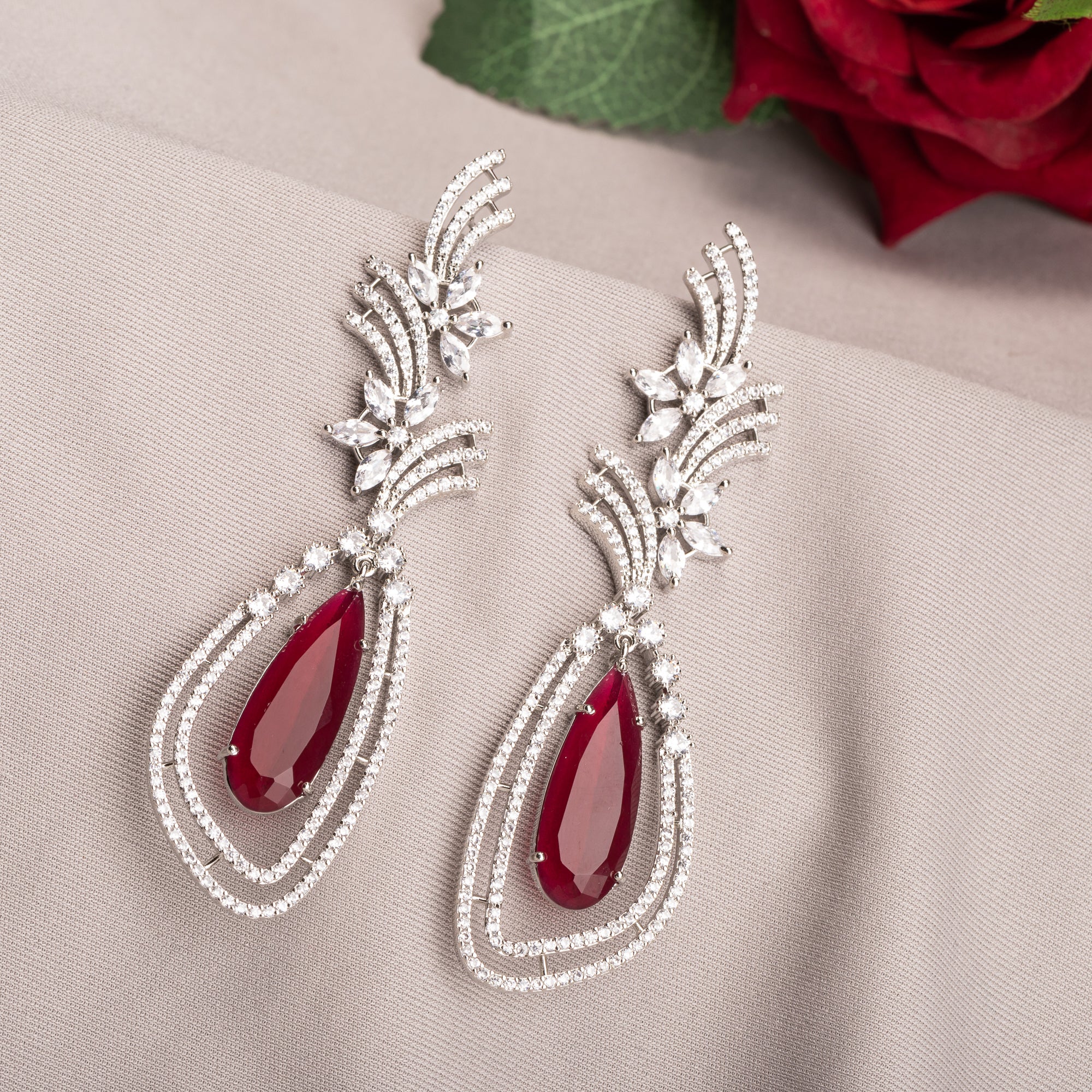 "Light pink zircon earrings offer a delicate sparkle with a serene, elegant touch."
