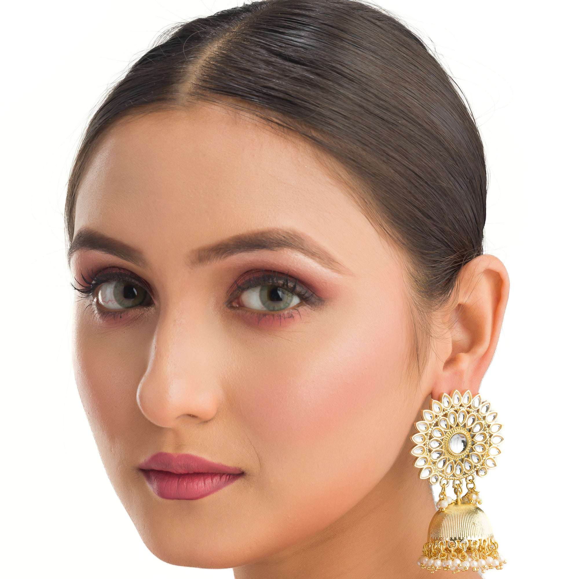 "Pearl and gold jhumka combines classic elegance with opulent shine for a festive look."