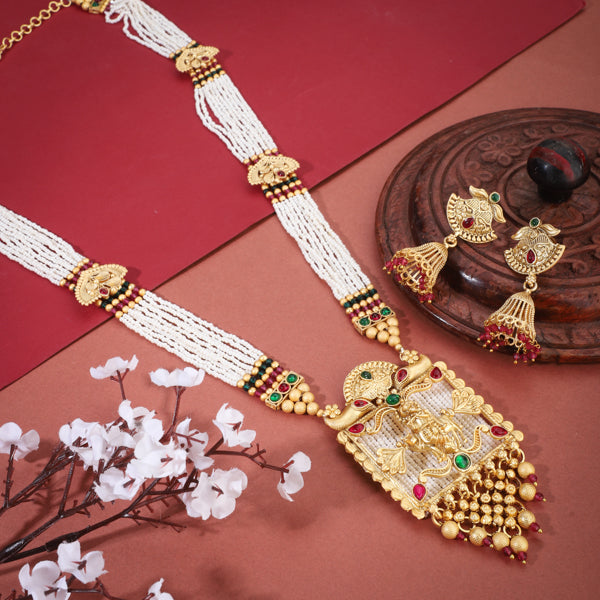 "Long temple necklace with multi-colored pearl beads adds vibrant, sophisticated flair."