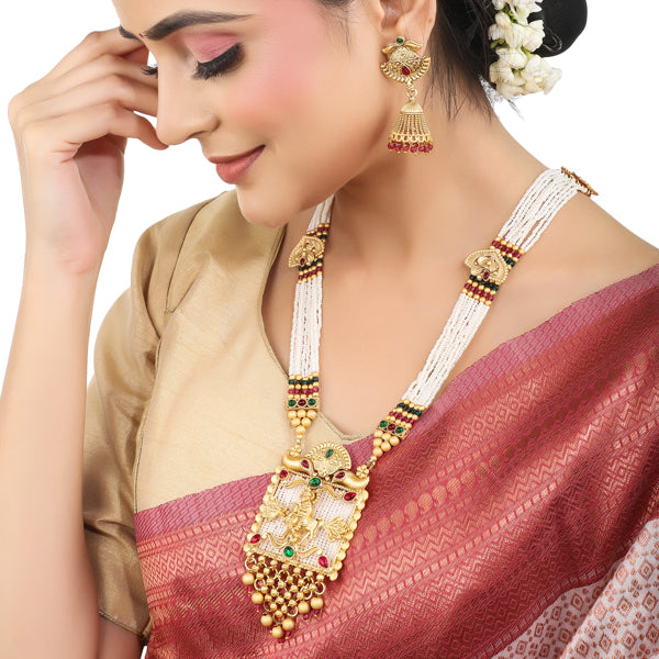 "Long temple necklace with multi-colored pearl beads adds vibrant, sophisticated flair."