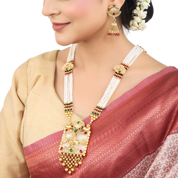 "Long temple necklace with multi-colored pearl beads adds vibrant, sophisticated flair."