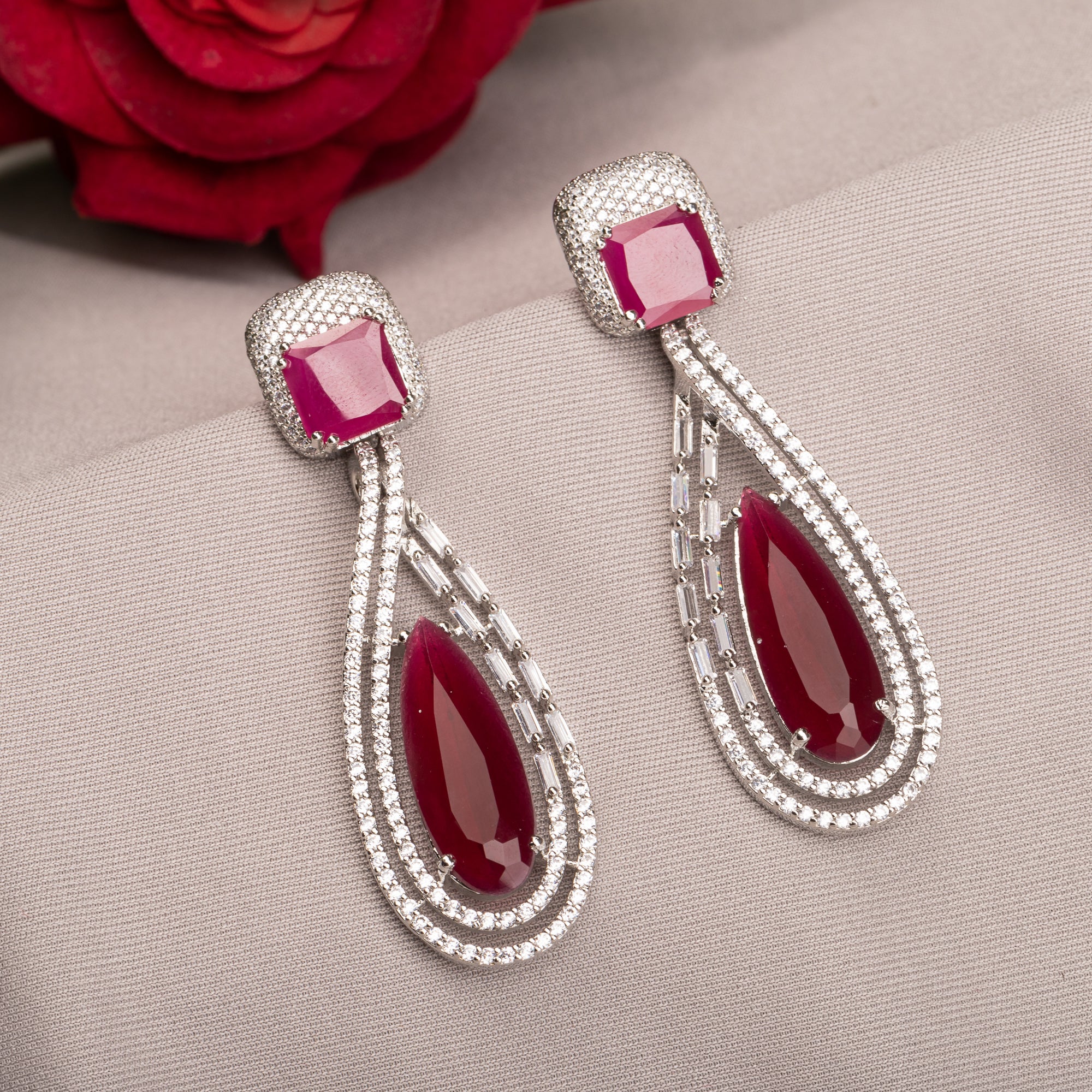 "Light pink zircon earrings offer a fresh, delicate sparkle with serene elegance."
