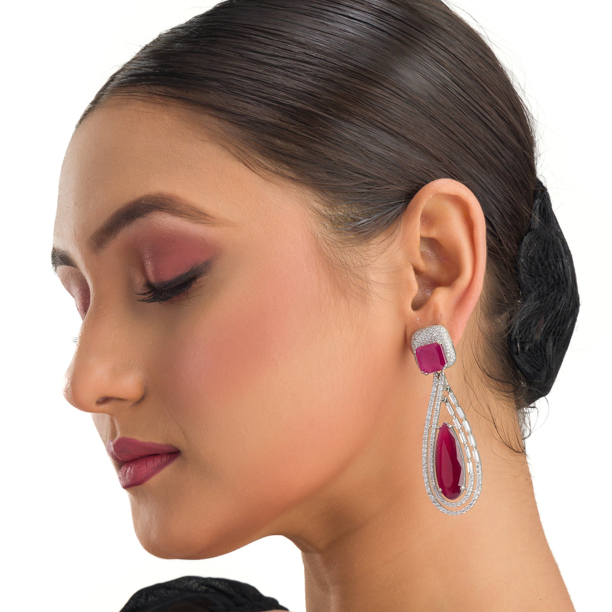 "Light pink zircon earrings offer a fresh, delicate sparkle with serene elegance."
