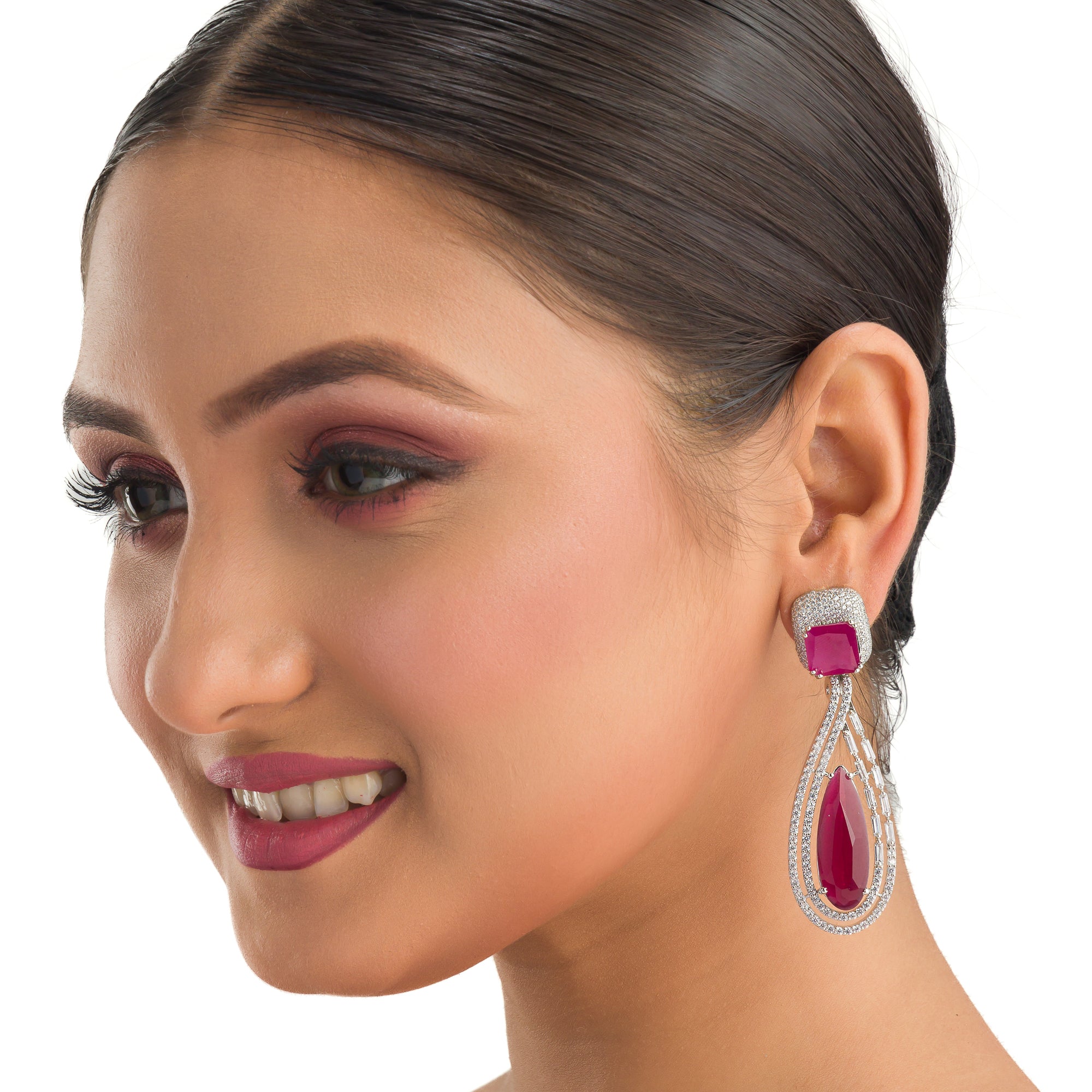 "Light pink zircon earrings offer a fresh, delicate sparkle with serene elegance."