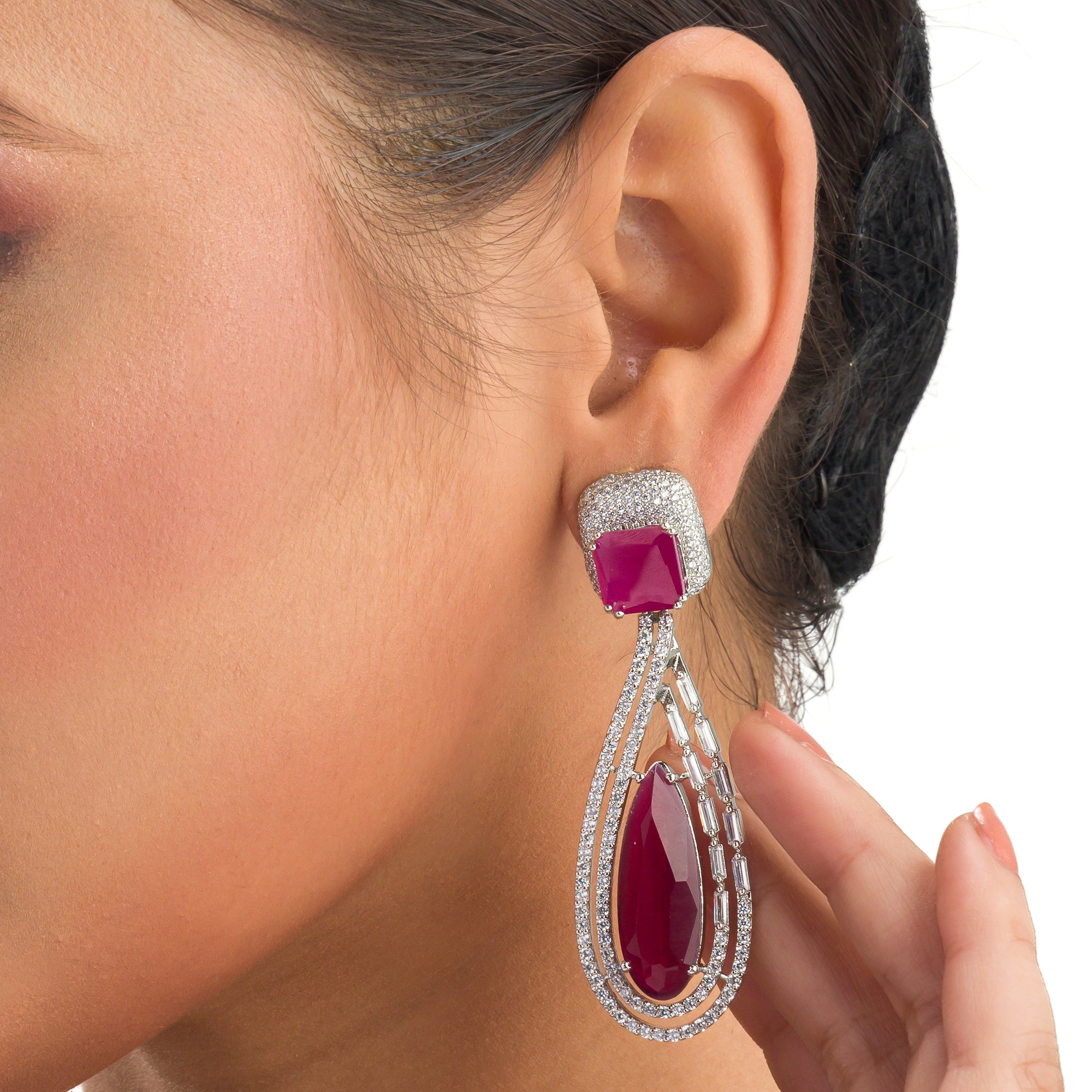 "Light pink zircon earrings offer a fresh, delicate sparkle with serene elegance."