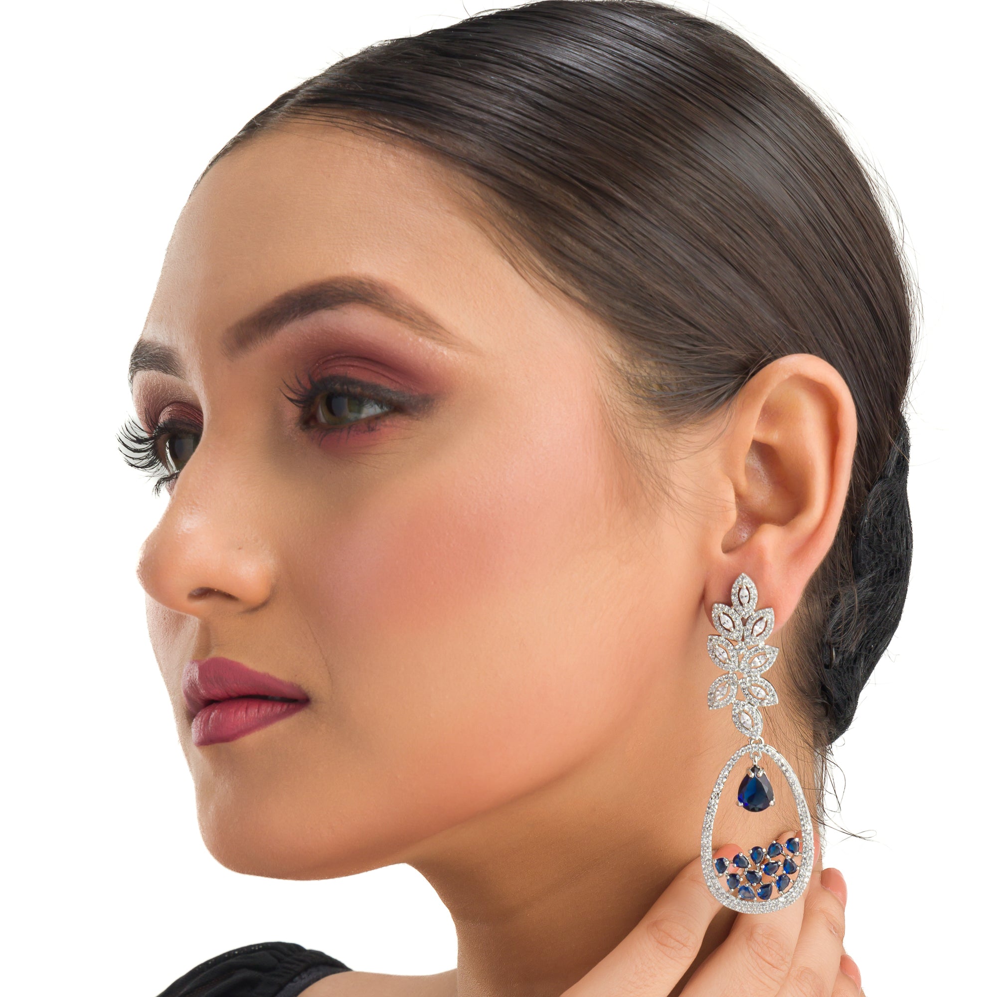 1. "Light blue zircon earrings offer a fresh, delicate sparkle with serene elegance."