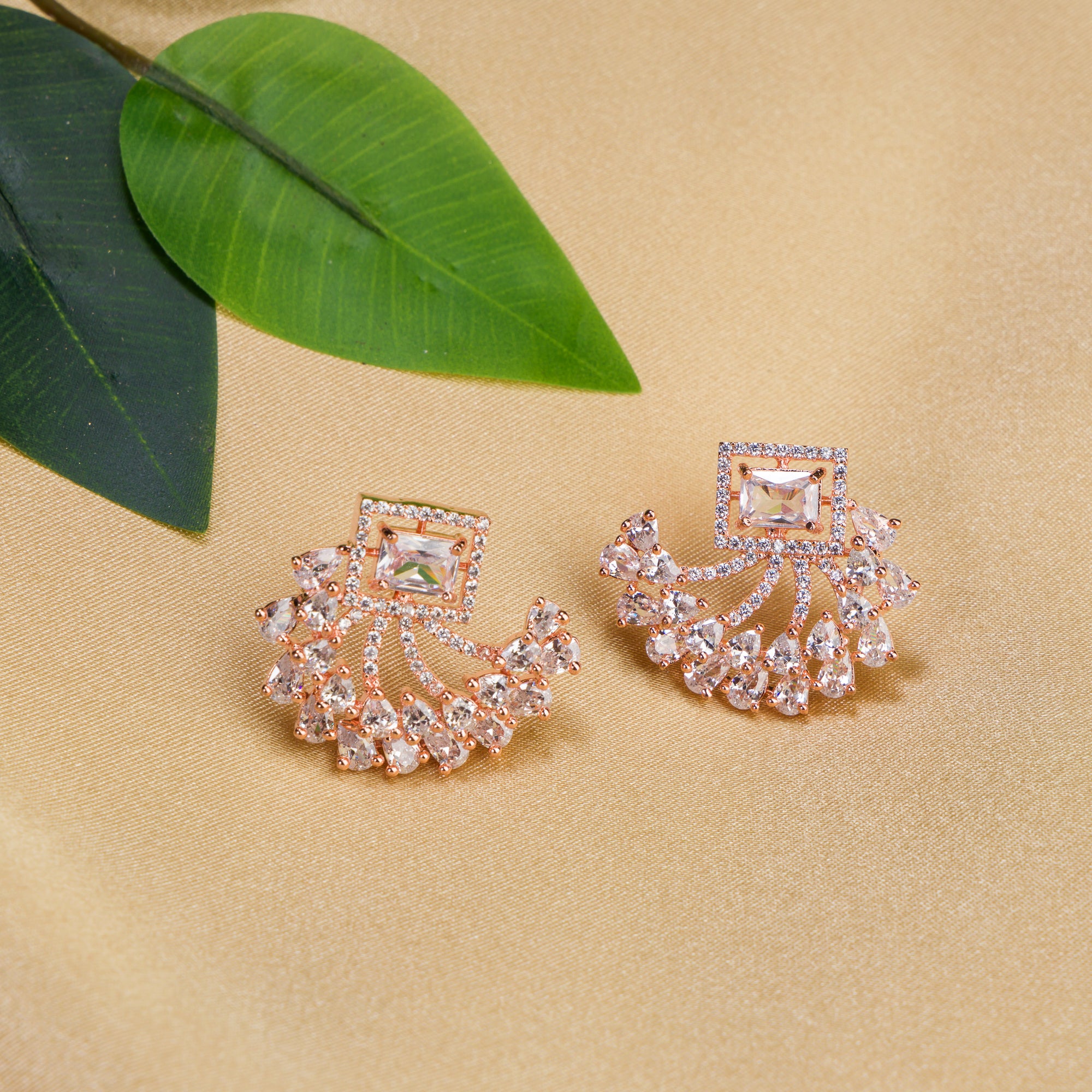 "Rose gold zircon studs add chic sparkle and refined glamour to your look."
