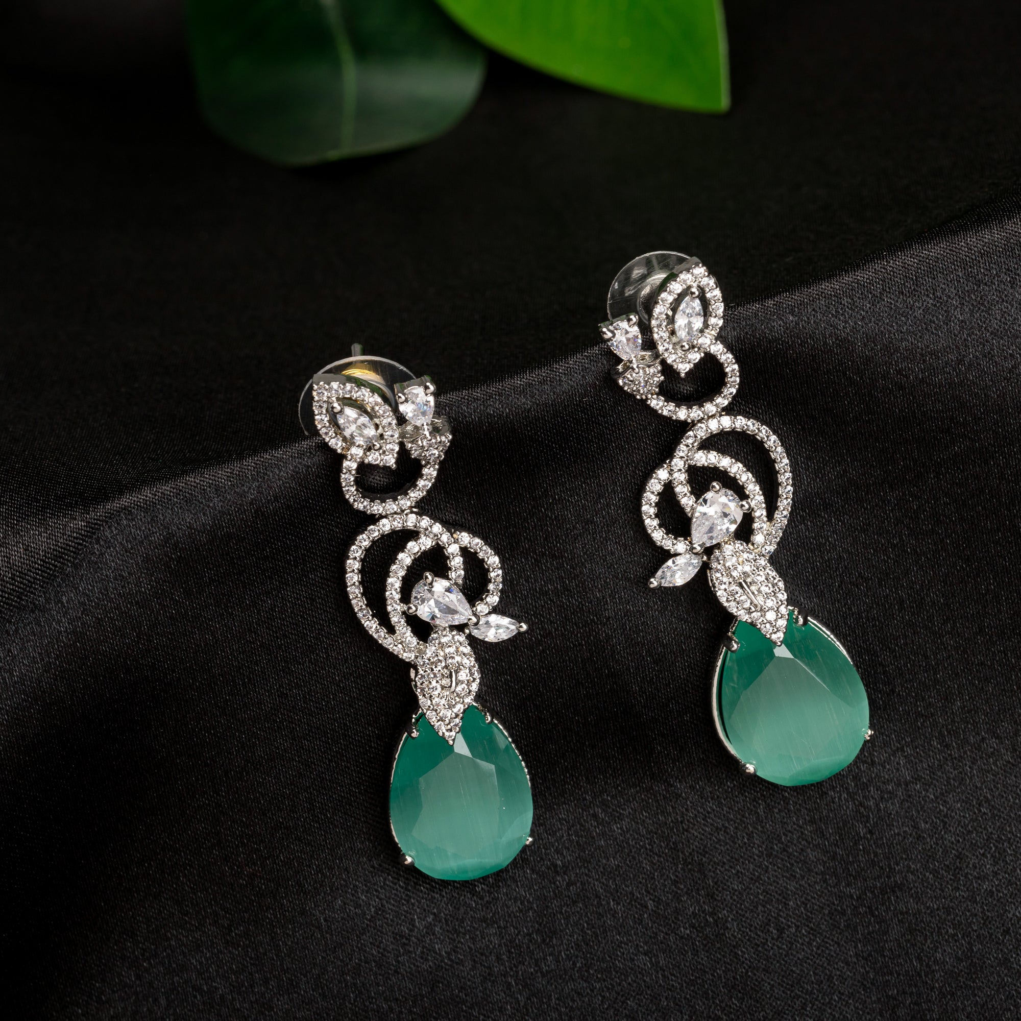 1. "Light green zircon earrings sparkle delicately, adding serene elegance to your look."