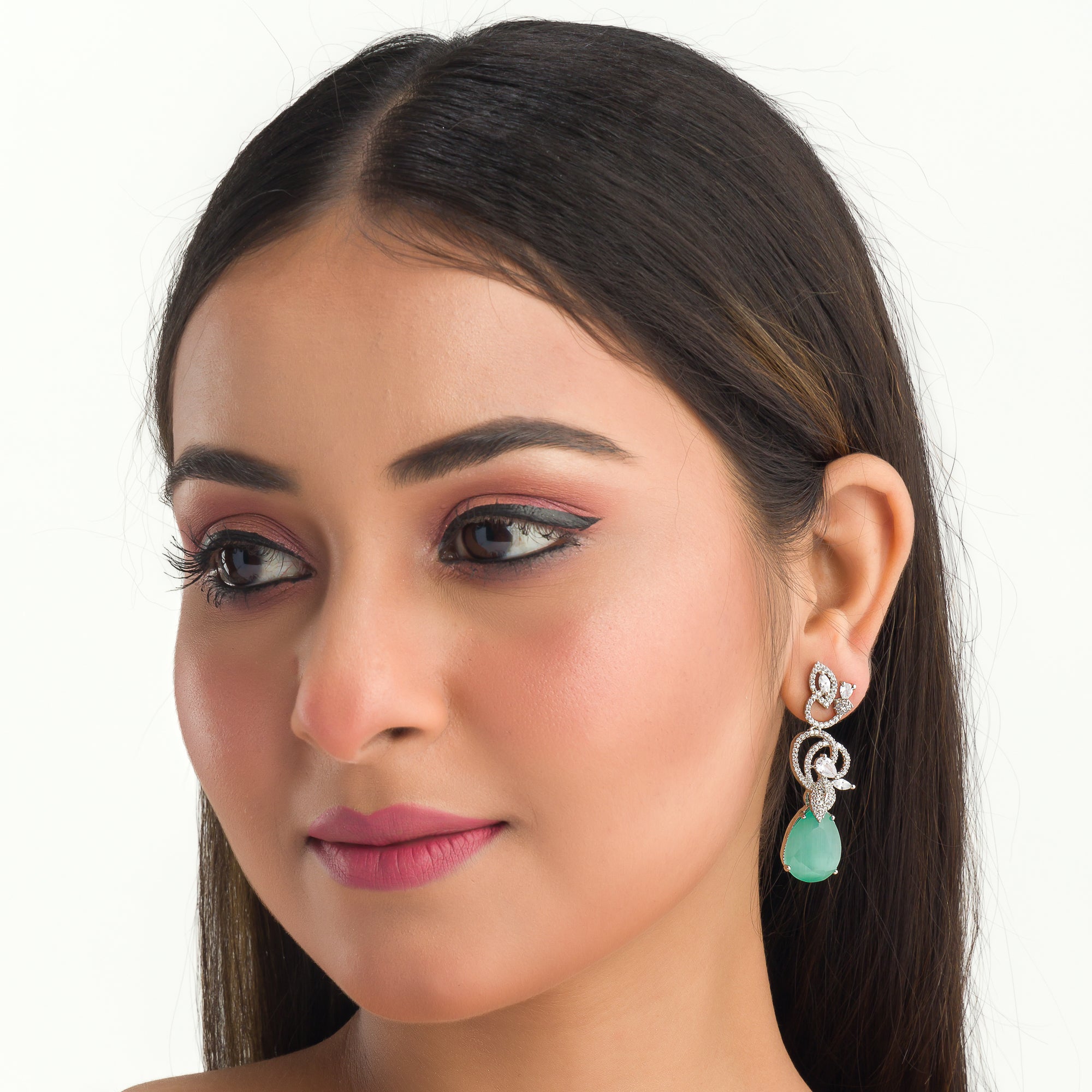1. "Light green zircon earrings sparkle delicately, adding serene elegance to your look."