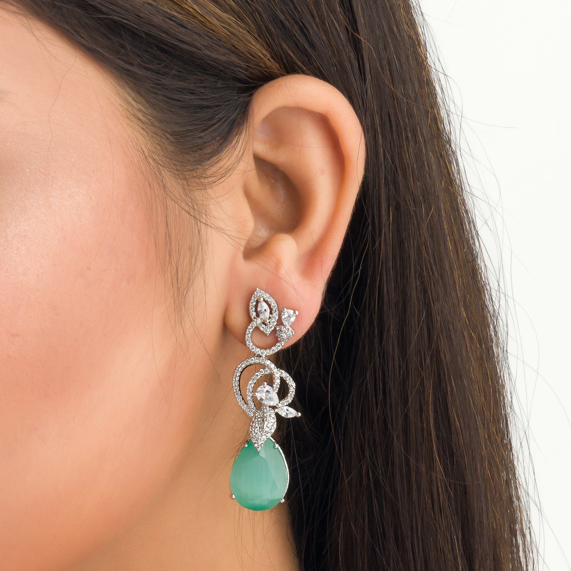 1. "Light green zircon earrings sparkle delicately, adding serene elegance to your look."