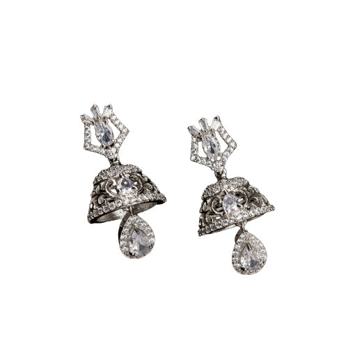 "Zircon jhumkas with intricate designs and sparkling stones create a dazzling statement."