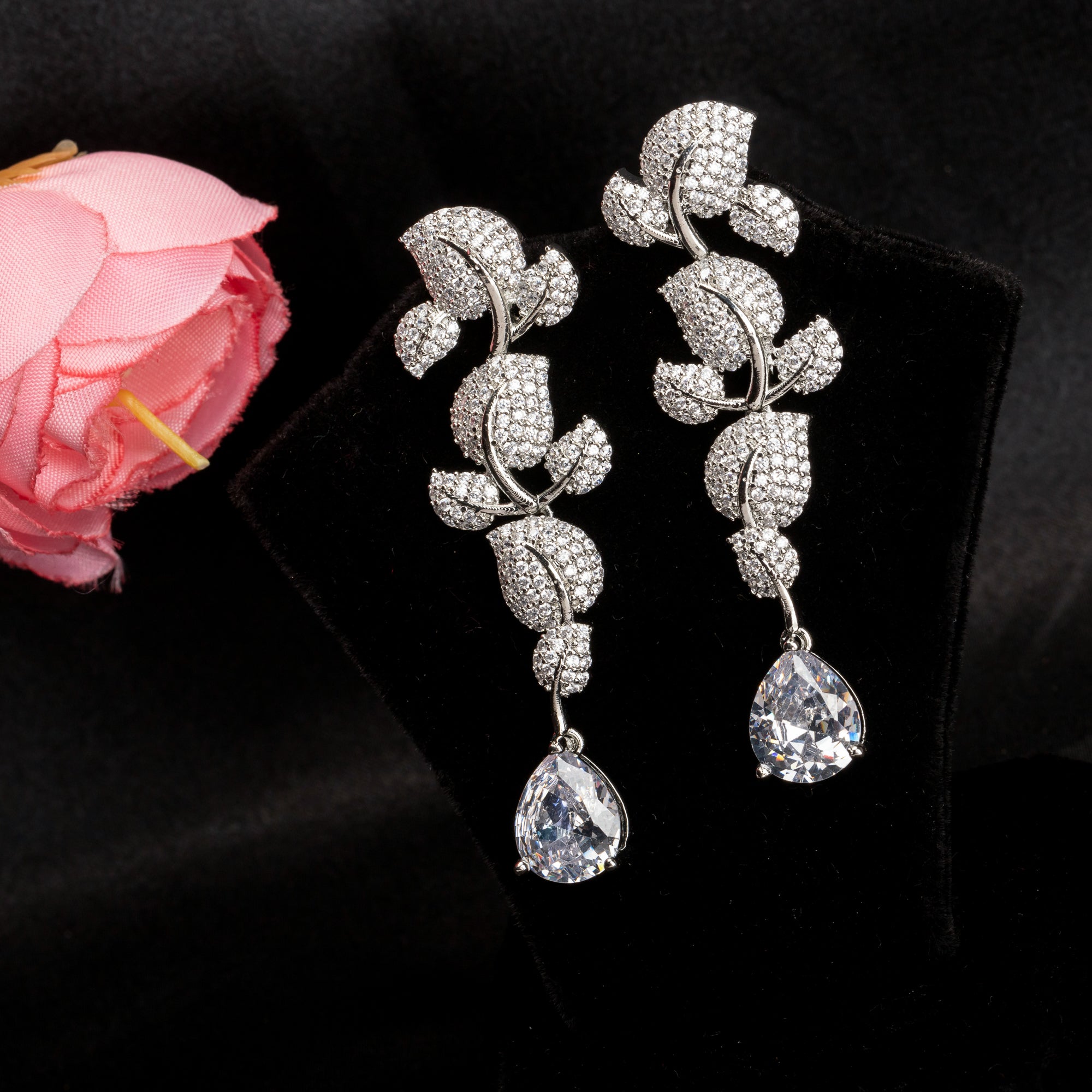 "Leaf design zircon earrings blend natureβs beauty with radiant zircon accents."