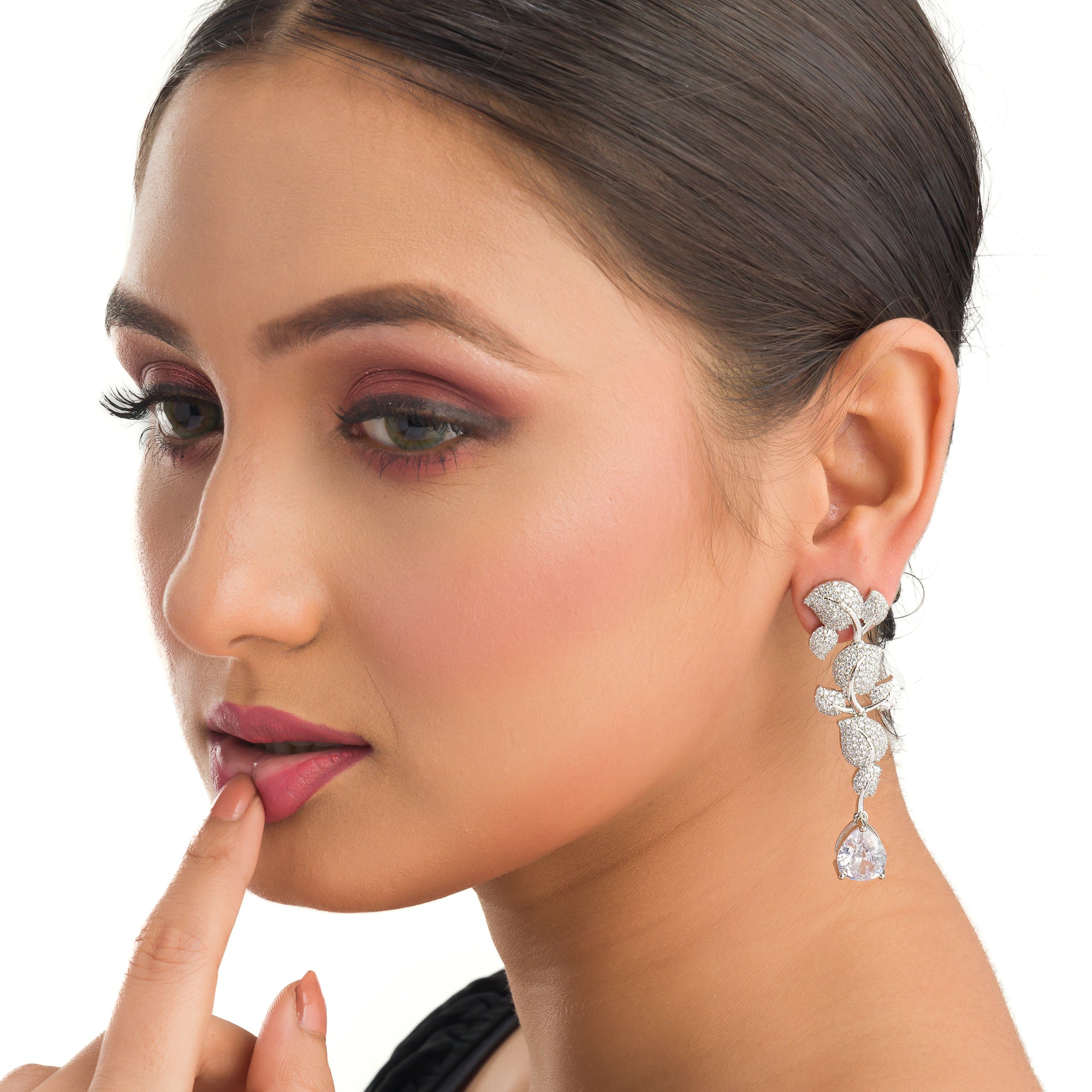 "Leaf design zircon earrings blend natureβs beauty with radiant zircon accents."