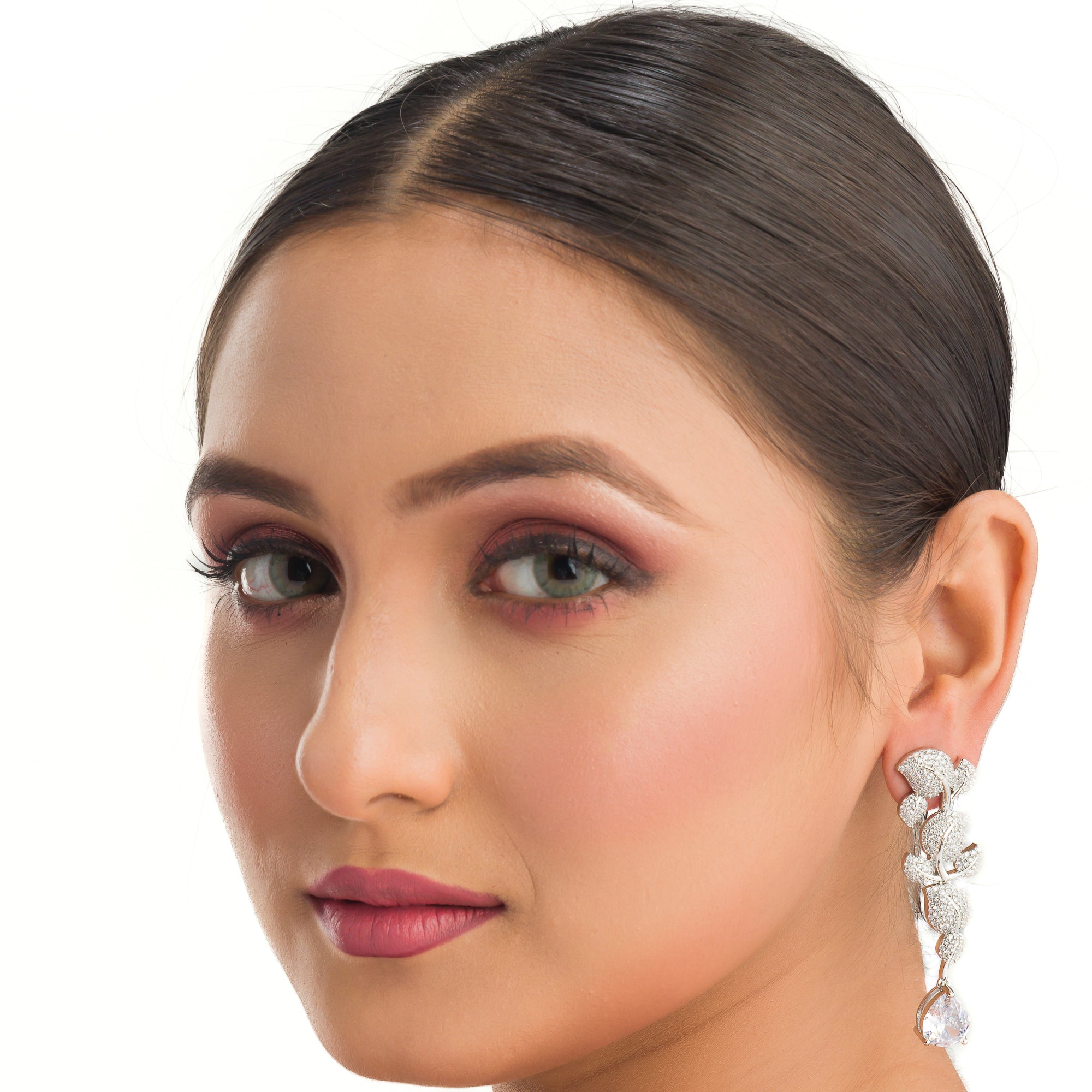 "Leaf design zircon earrings blend natureβs beauty with radiant zircon accents."