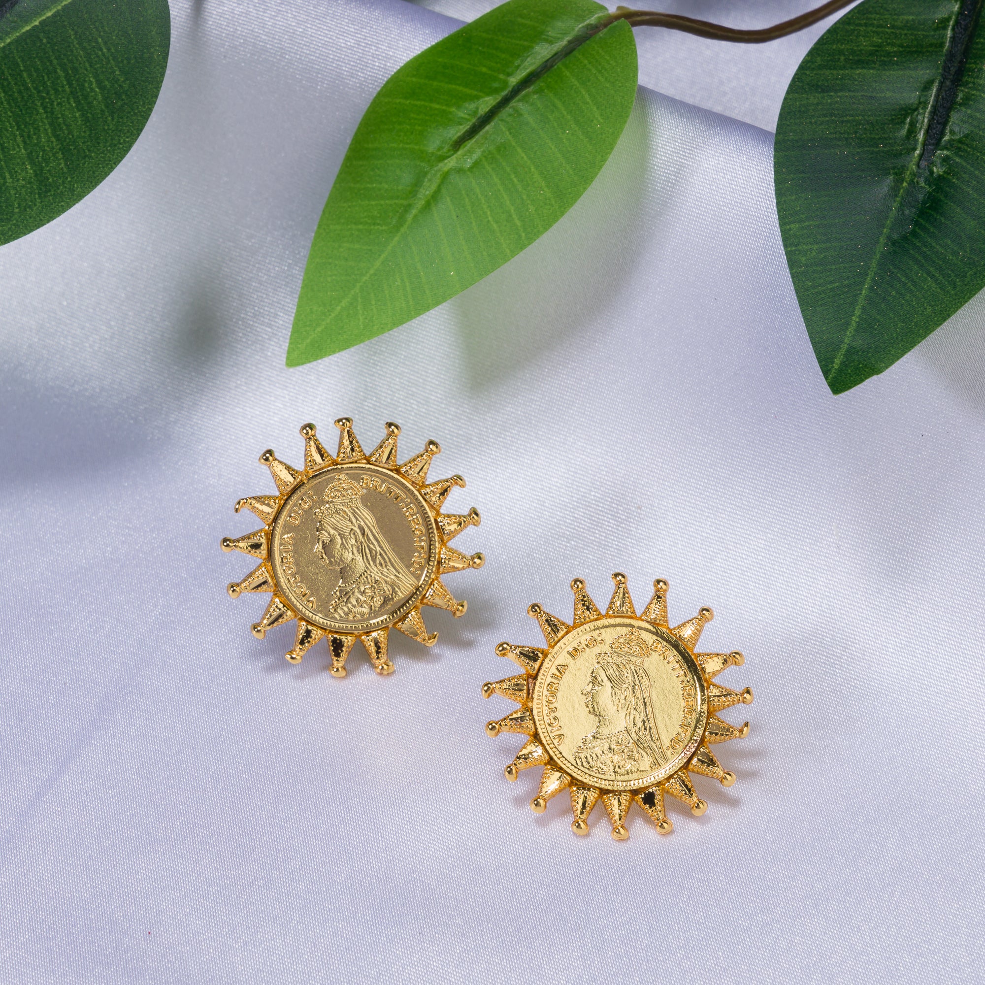 "Sun design Rani Victoria earrings mix regal elegance with timeless classic style."