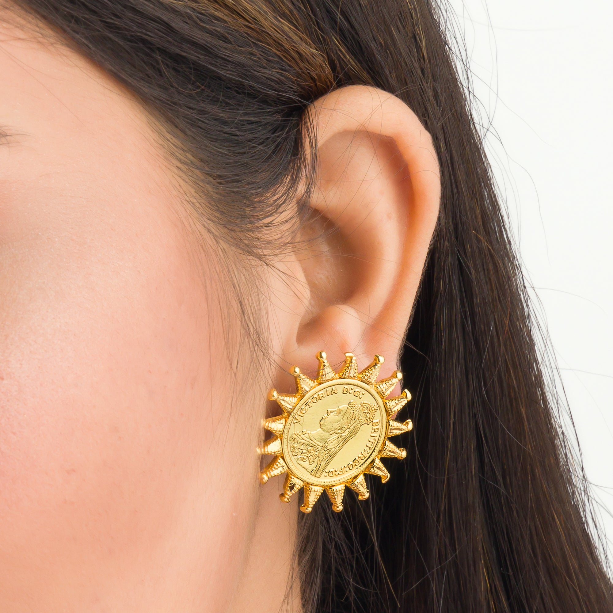 "Sun design Rani Victoria earrings mix regal elegance with timeless classic style."