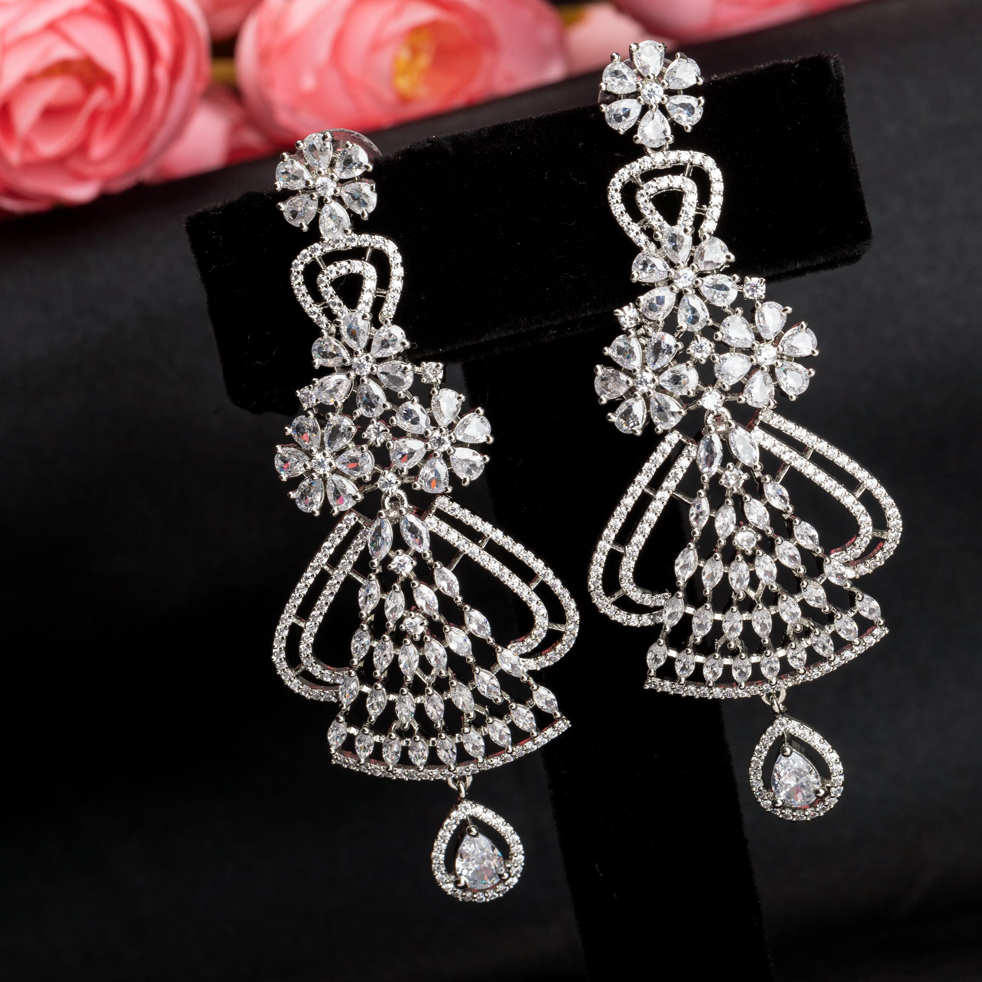 "Zircon dangler earrings sparkle with deep, captivating brilliance, perfect for any occasion."
