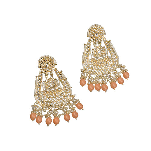 "Salmon color Kundan earrings make a bold, elegant statement for festive occasions."