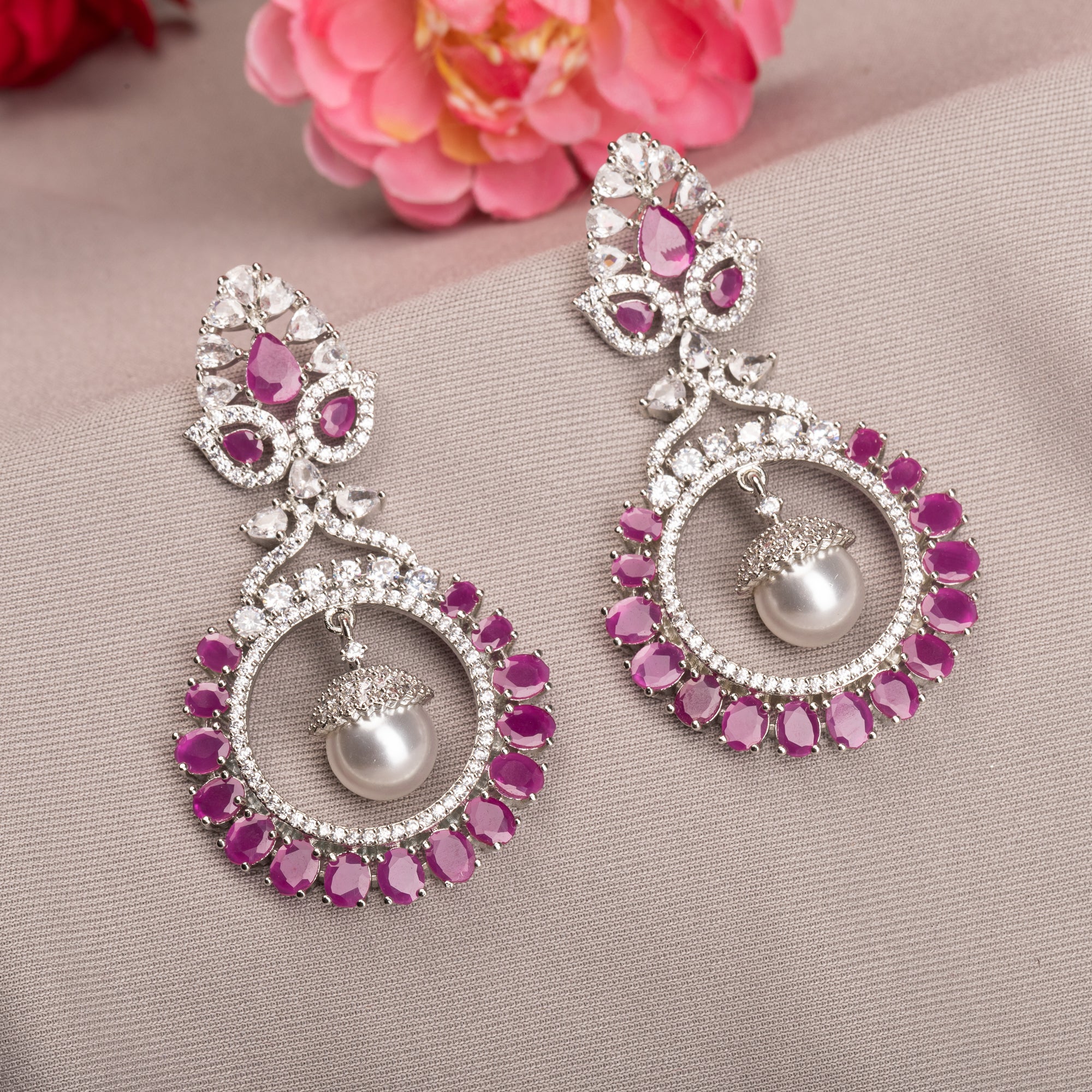 "Pink zircon dangler earrings offer fresh sparkle with a serene, elegant touch."