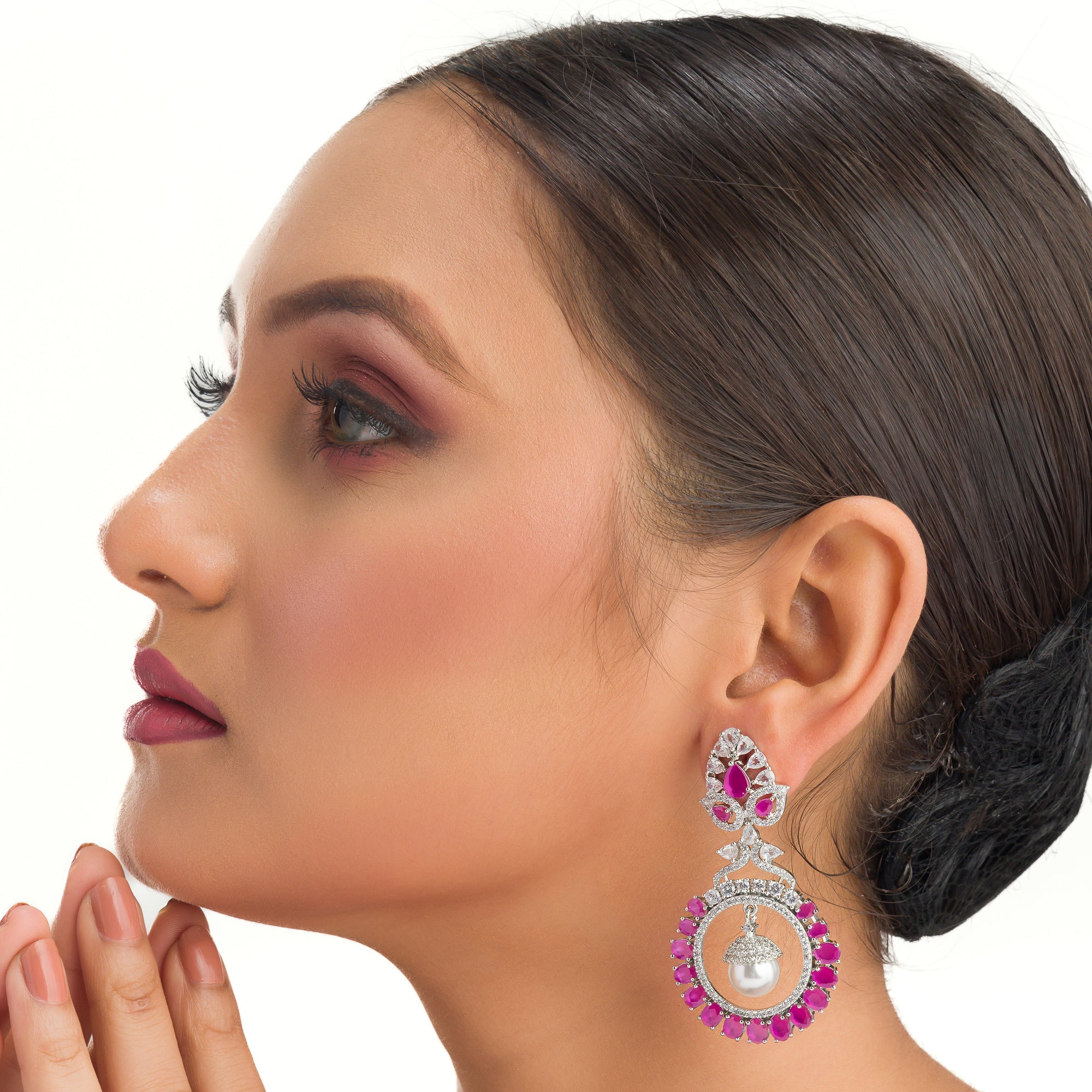 "Pink zircon dangler earrings offer fresh sparkle with a serene, elegant touch."