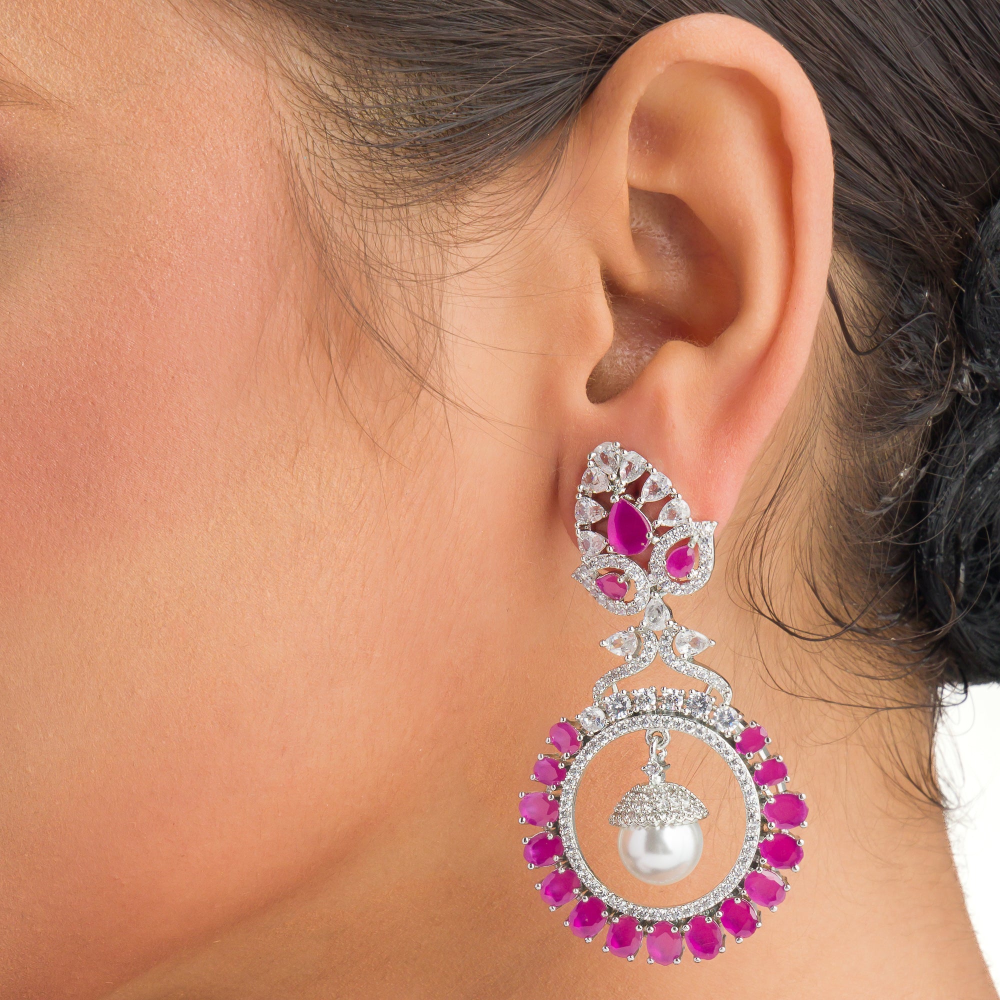 "Pink zircon dangler earrings offer fresh sparkle with a serene, elegant touch."