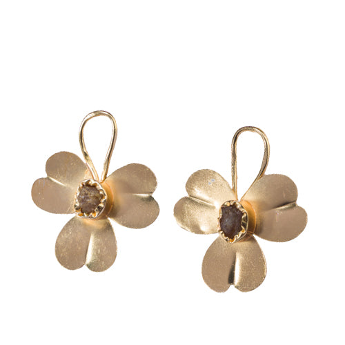 "Gold-tone flower studs with uncut stones offer timeless elegance for any occasion."