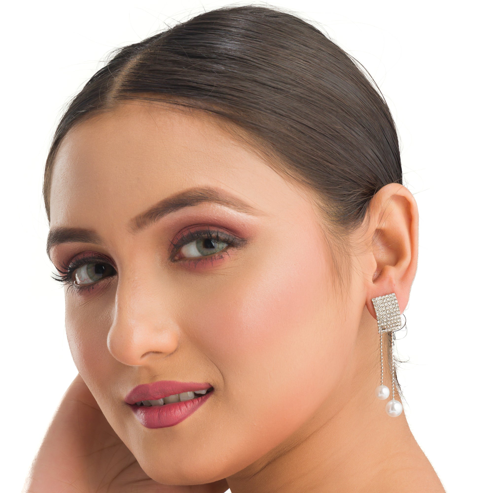 "Silver zircon earrings with hanging pearls offer elegant sparkle and sophistication."
