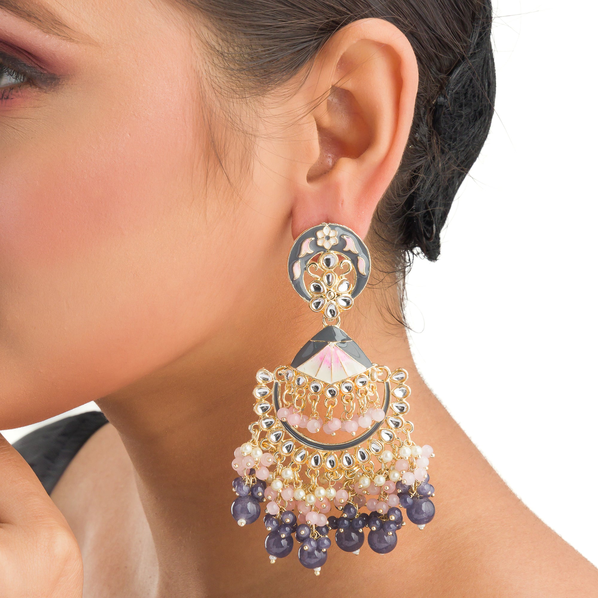 "Pink and white zircon jhumkas blend vibrant color with timeless elegance for a stunning look."